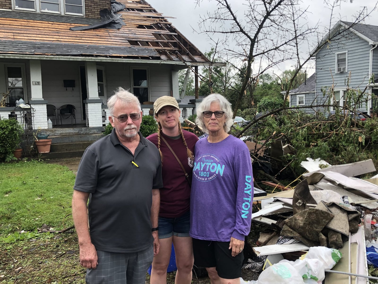 Dani Praeter (center) came to help her parents, Robin and Chris Sassenberg, clean up after the tornado. After the tornado was gone, Chris emerged from the basement.  “What really got me was opening the bathroom door and there was nothing but sky,” he said. “It looked worse in the morning.”  AMELIA ROBINSON/STAFF