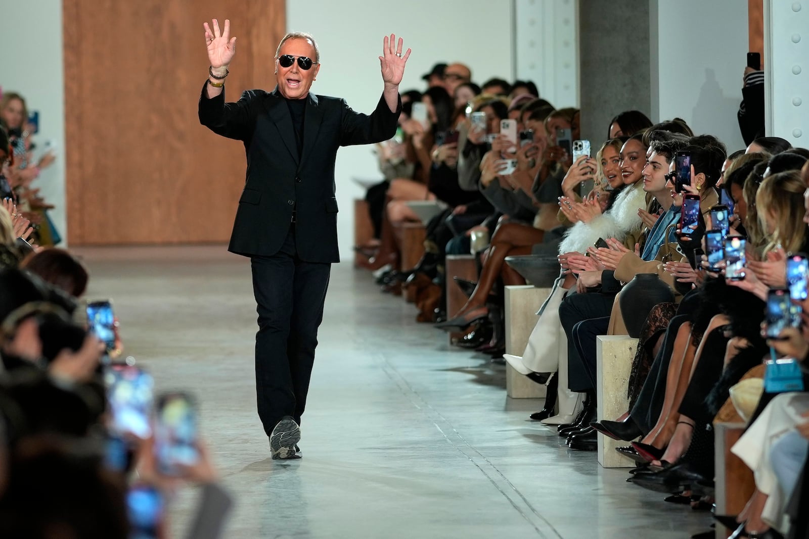 Michael Kors walks the runway during the Michael Kors Fall/Winter 2025 fashion show as part of New York Fashion Week on Tuesday, Feb. 11, 2025, at Terminal Warehouse in New York. (Photo by Charles Sykes/Invision/AP)