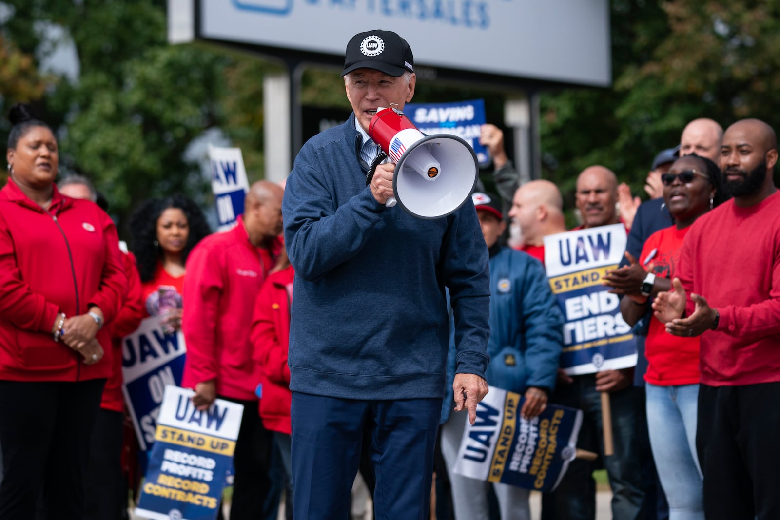 FILE - President Joe Biden speaks to striking United Auto Workers on the picket line outside the Willow Run Redistribution Center, UAW Local 174, Sept. 26, 2023, in Van Buren Township, Mich. (AP Photo/Evan Vucci, File)