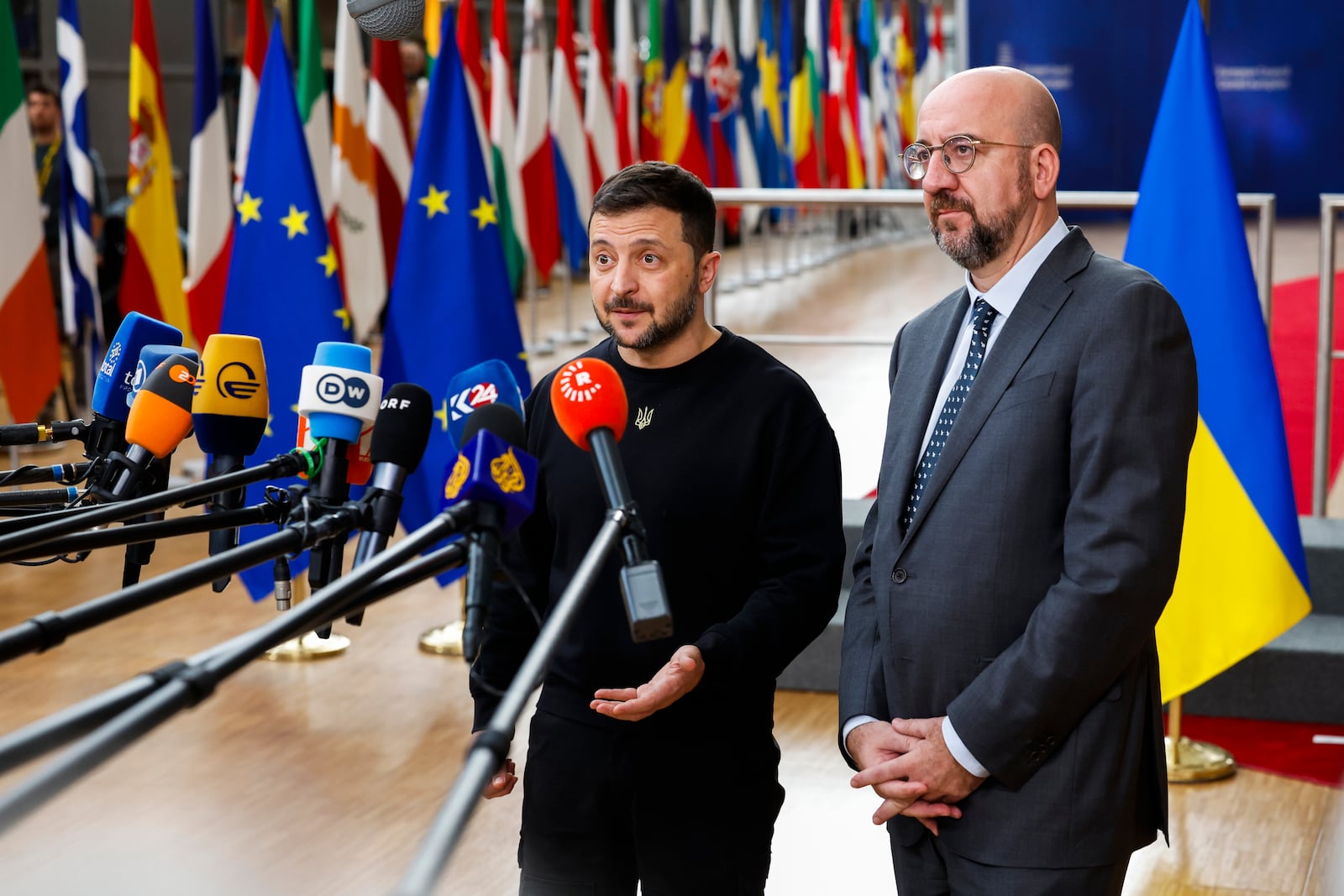 Ukraine's President Volodymyr Zelenskyy, left, and European Council President Charles Michel talk to journalists as they arrive to an EU summit in Brussels, Thursday, Oct. 17, 2024. (AP Photo/Geert Vanden Wijngaert)