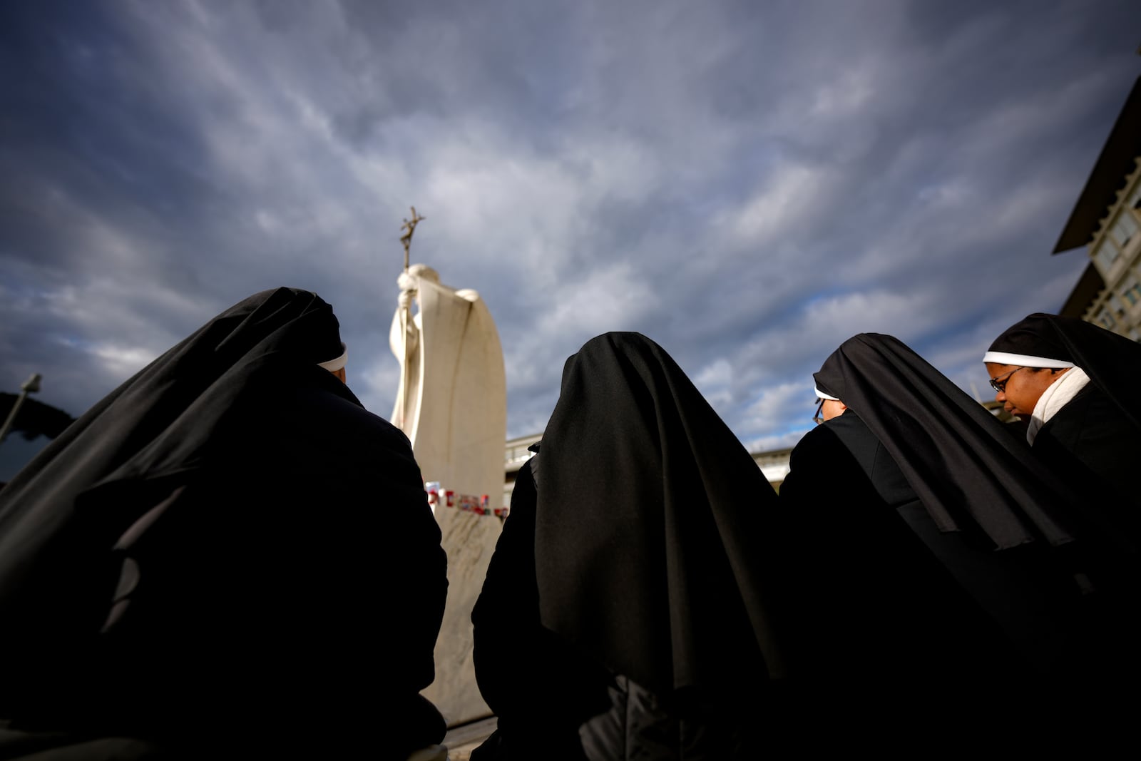 Nuns pray for Pope Francis in front of the Agostino Gemelli Polyclinic, in Rome, Thursday, Feb. 27, 2025, where Pope Francis is hospitalized since Friday, Feb. 14. (AP Photo/Andrew Medichini)