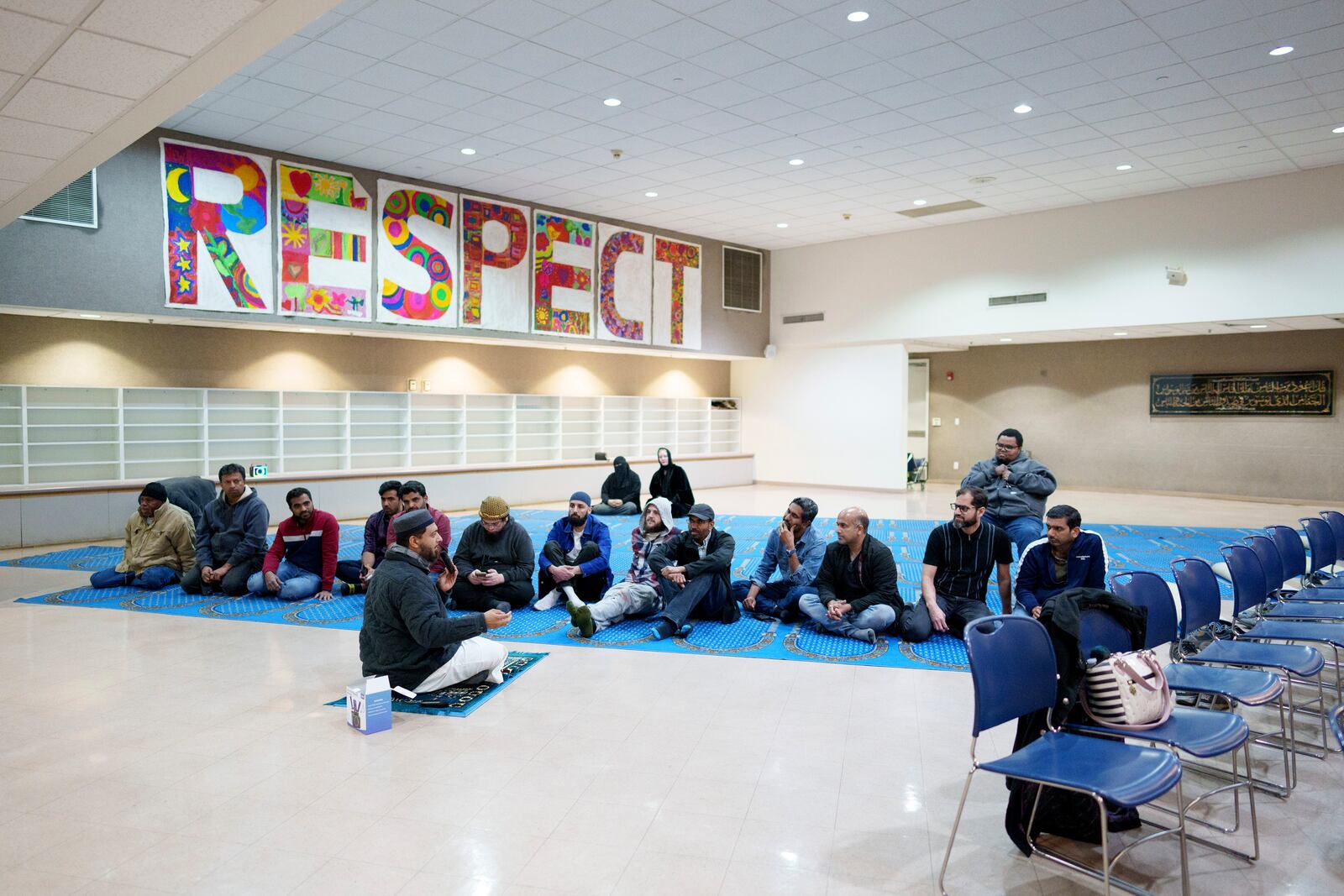 Members of an Altadena mosque, which burned in the Eaton fire, discuss plans for Ramadan after prayer during a community gathering held at New Horizon Islamic School in Pasadena, California, Saturday, Feb. 15, 2025. (AP Photo/Eric Thayer)