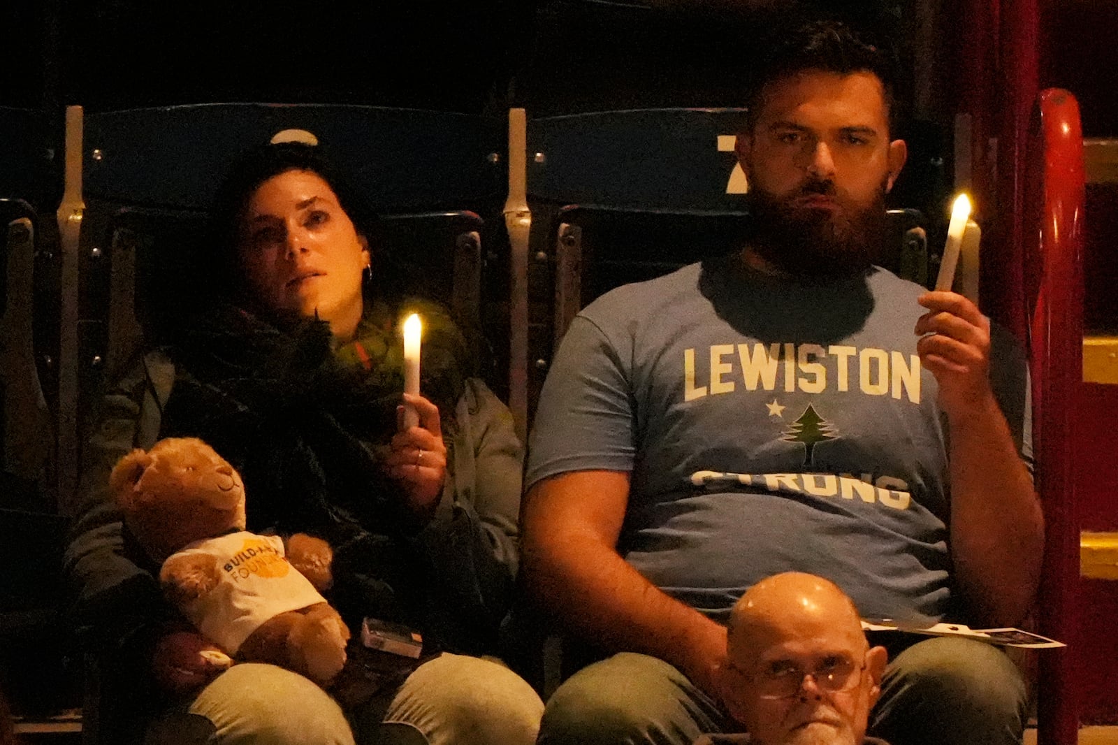 Attendees observe a moment of silence at a commemoration event to mark the one year anniversary of the mass shooting in Lewiston, Maine, Friday, Oct. 25, 2024. (AP Photo/Robert F. Bukaty)