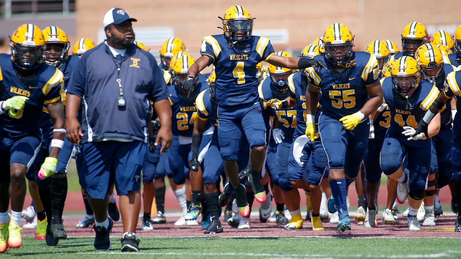 Springfield takes the field before a game against St. Louis De Smet Jesuit 29-22 in Indianapolis on Saturday, Aug. 27, 2022. Michael Cooper/CONTRIBUTED