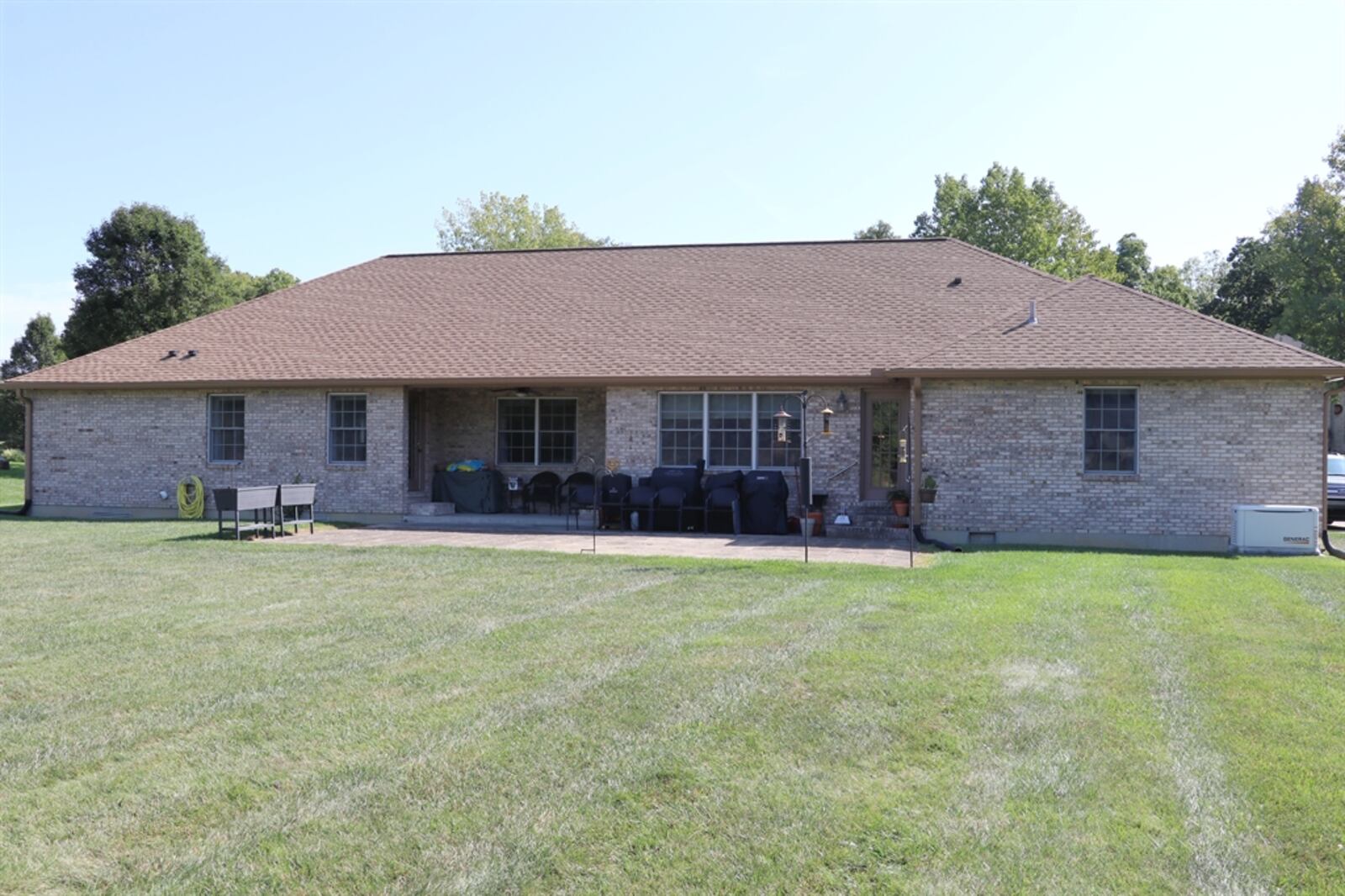 In Fairborn, the half-acre property has a two-car, side-entry garage and a large concrete patio.