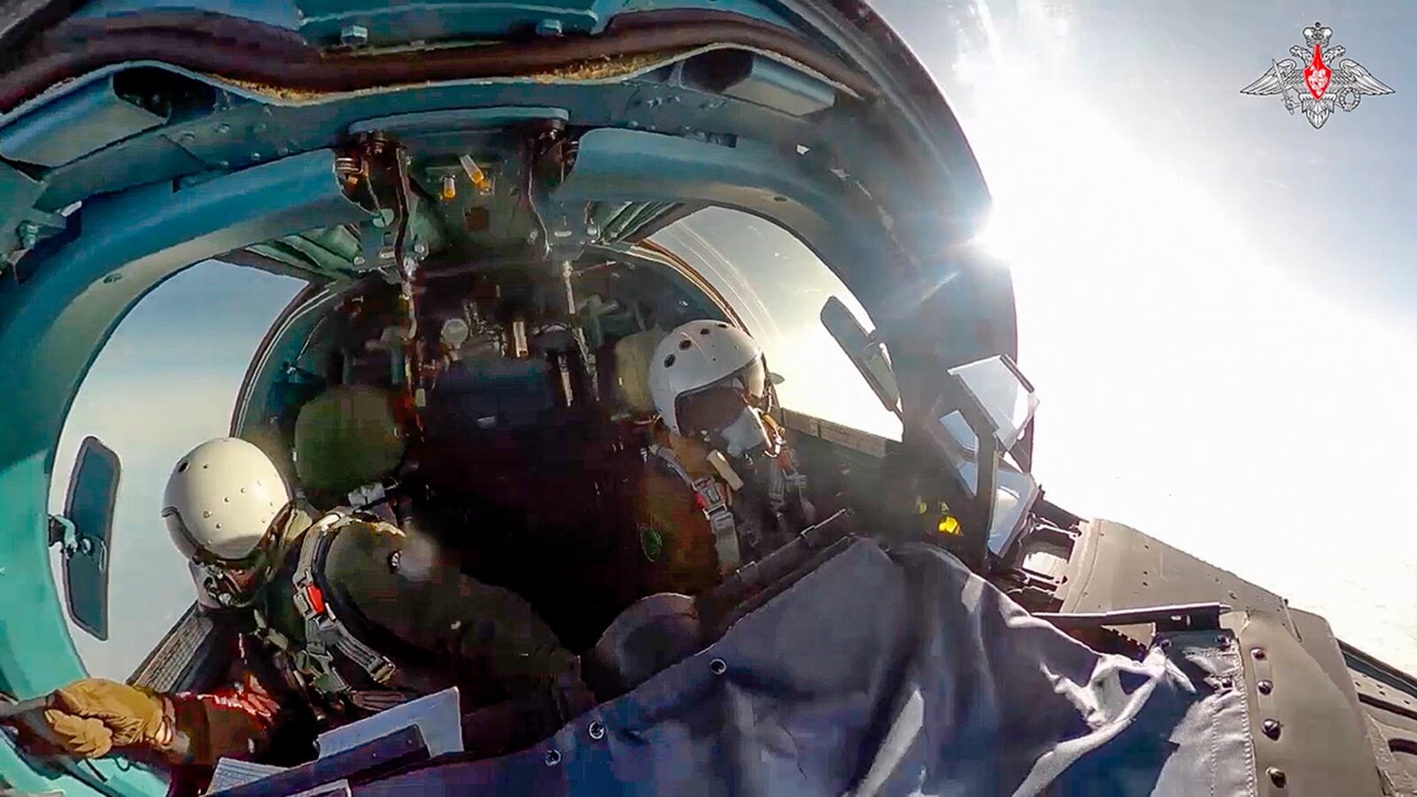 In this photo taken from video released by the Russian Defense Ministry on Thursday, Nov. 28, 2024, pilots of an Su-34 bomber of the Russian air force fly at an undisclosed location in Ukraine. (Russian Defense Ministry Press Service photo via AP)