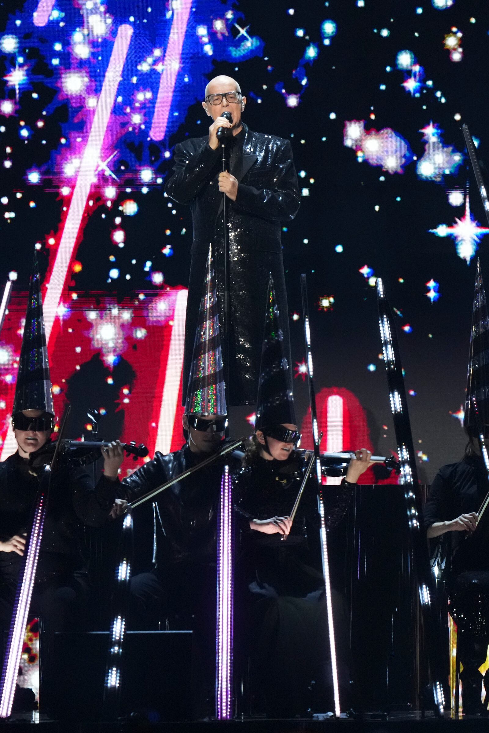 Neil Tennant from the 'Pet Shop Boys' performs alongside the Manchester Camerata during the MTV European Music Awards in Manchester, England, Sunday, Nov. 10, 2024. (Scott A Garfitt/Invision/AP)