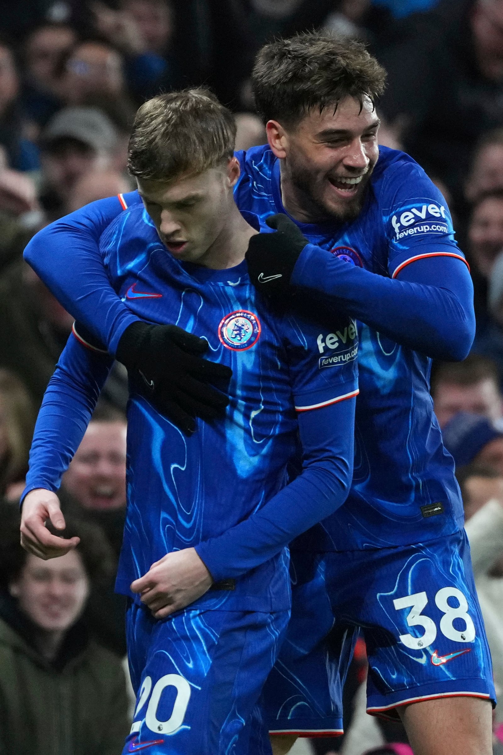 Chelsea's Cole Palmer, left, and Chelsea's Marc Guiu celebrate after an own goal by West Ham's Aaron Wan-Bissaka during the English Premier League soccer match between Chelsea and West Ham United at Stamford Bridge stadium in London, Monday, Feb. 3, 2025. (AP Photo/Kirsty Wigglesworth)