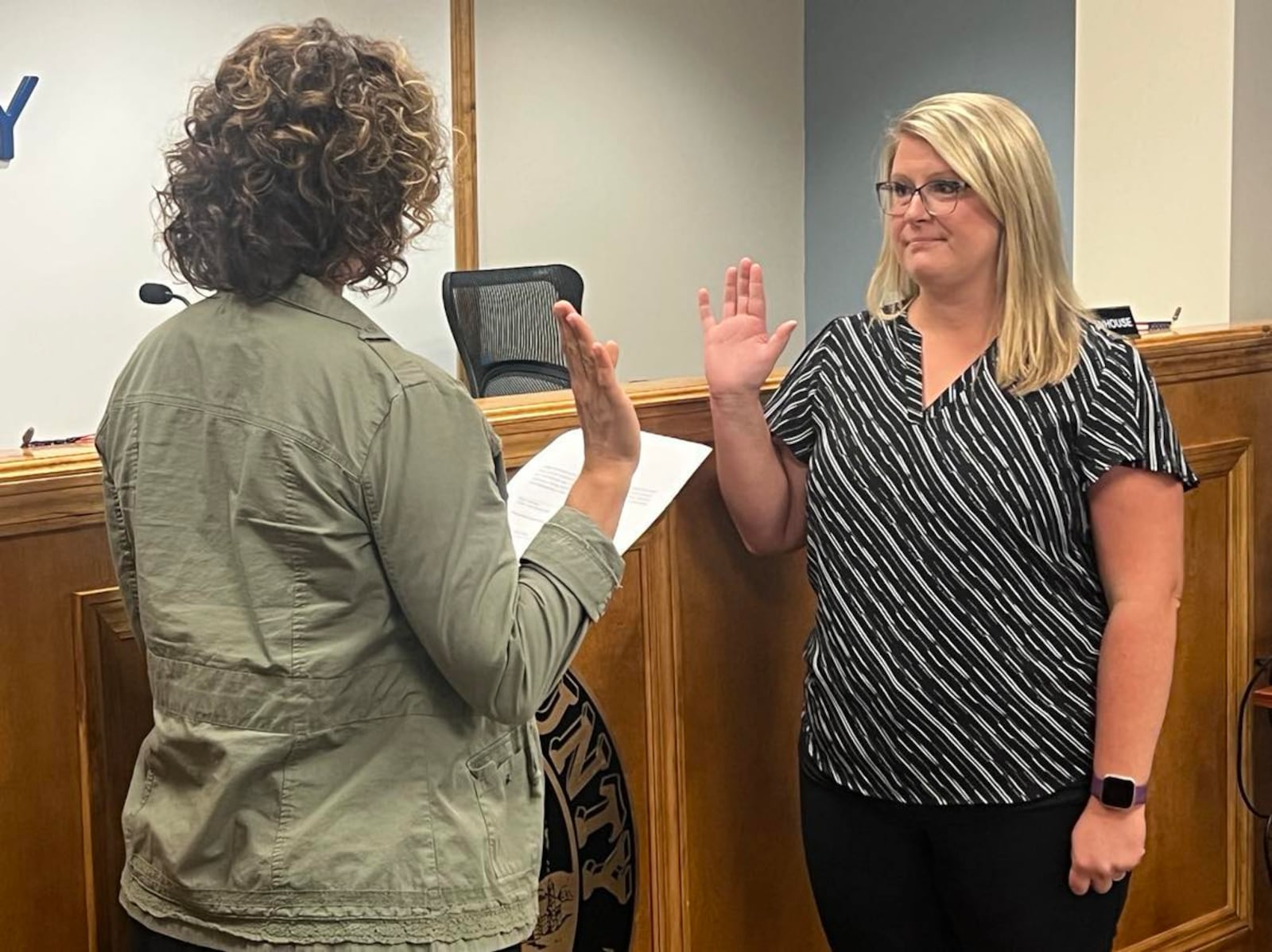 Commissioner Melanie Flax Wilt (left) swears in Hillary Hamilton as acting county auditor on Wednesday, Aug. 30, 2023. CONTRIBUTED