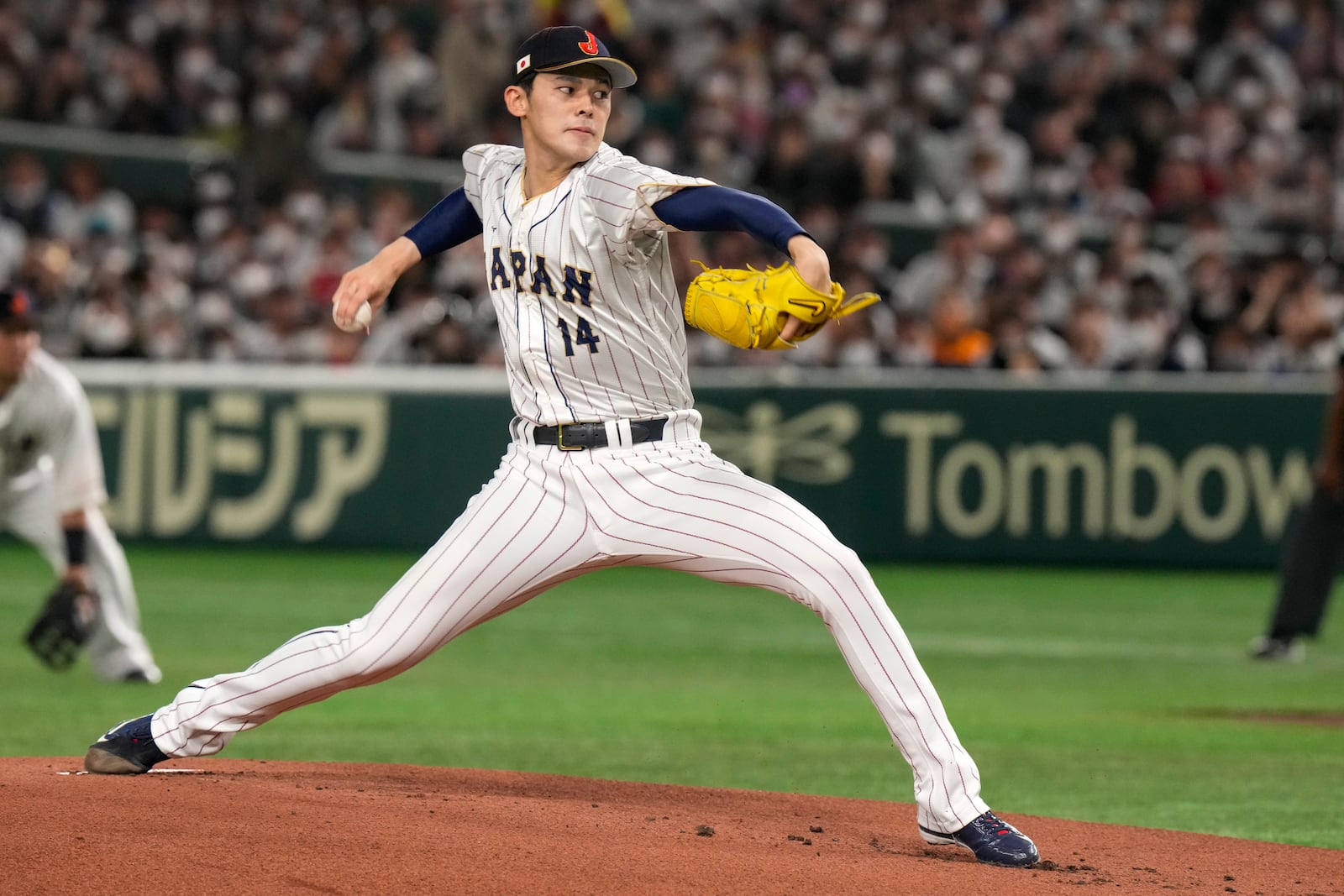 FILE - Japan's Roki Sasak pitches during a Pool B game against the Czech Republic at the World Baseball Classic at the Tokyo Dome, Japan, March 11, 2023. (AP Photo/Eugene Hoshiko, File)