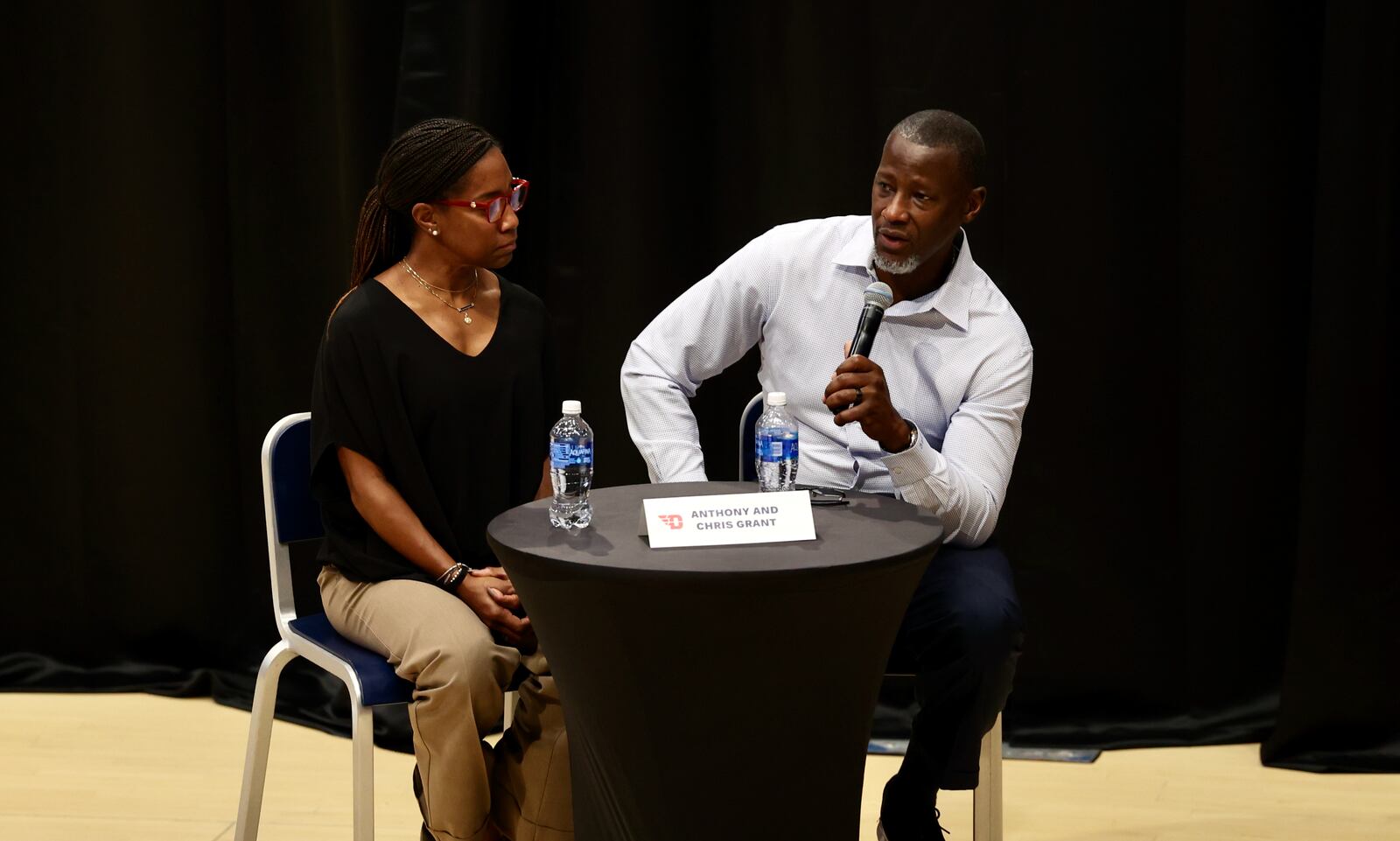 Chris Grant and Dayton coach Anthony Grant participate in "The Spotlight, To Shine A Light On Mental Health" on Thursday, Oct. 19, 2023, at UD Arena. David Jablonski/Staff