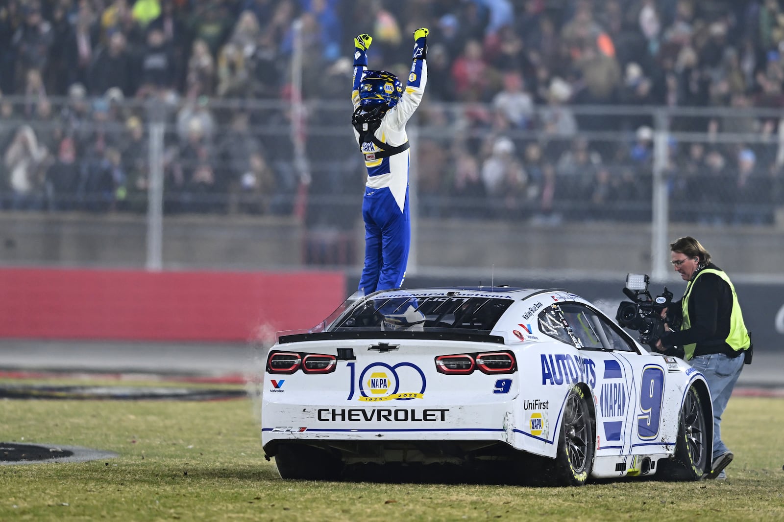 Chase Elliott celebrates after winning a NASCAR Cup Series auto race at Bowman Gray Stadium, Sunday, Feb. 2, 2025, in Winston-Salem, N.C. (AP Photo/Matt Kelley)