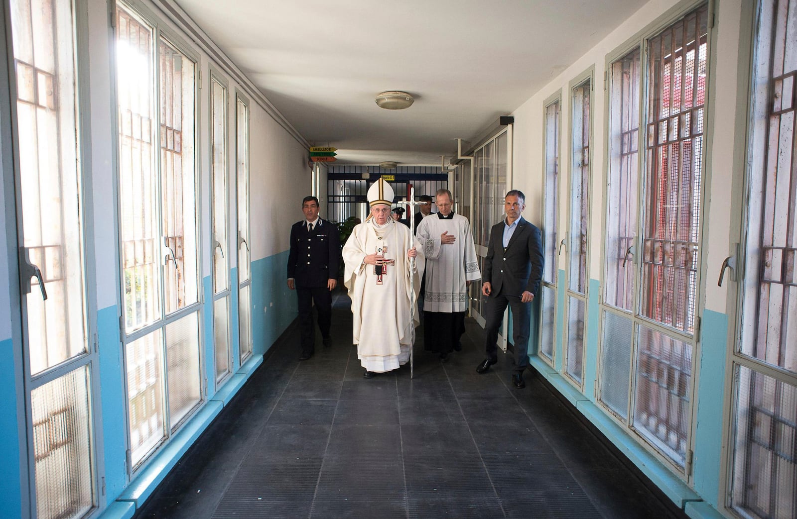 FILE - In this April 2, 2015 pool photo Pope Francis, center, holds the pastoral staff as he arrives for a Holy Thursday homily in the Rebibbia prison chapel in Rome. (AP Photo/L'Osservatore Romano, Pool, File)