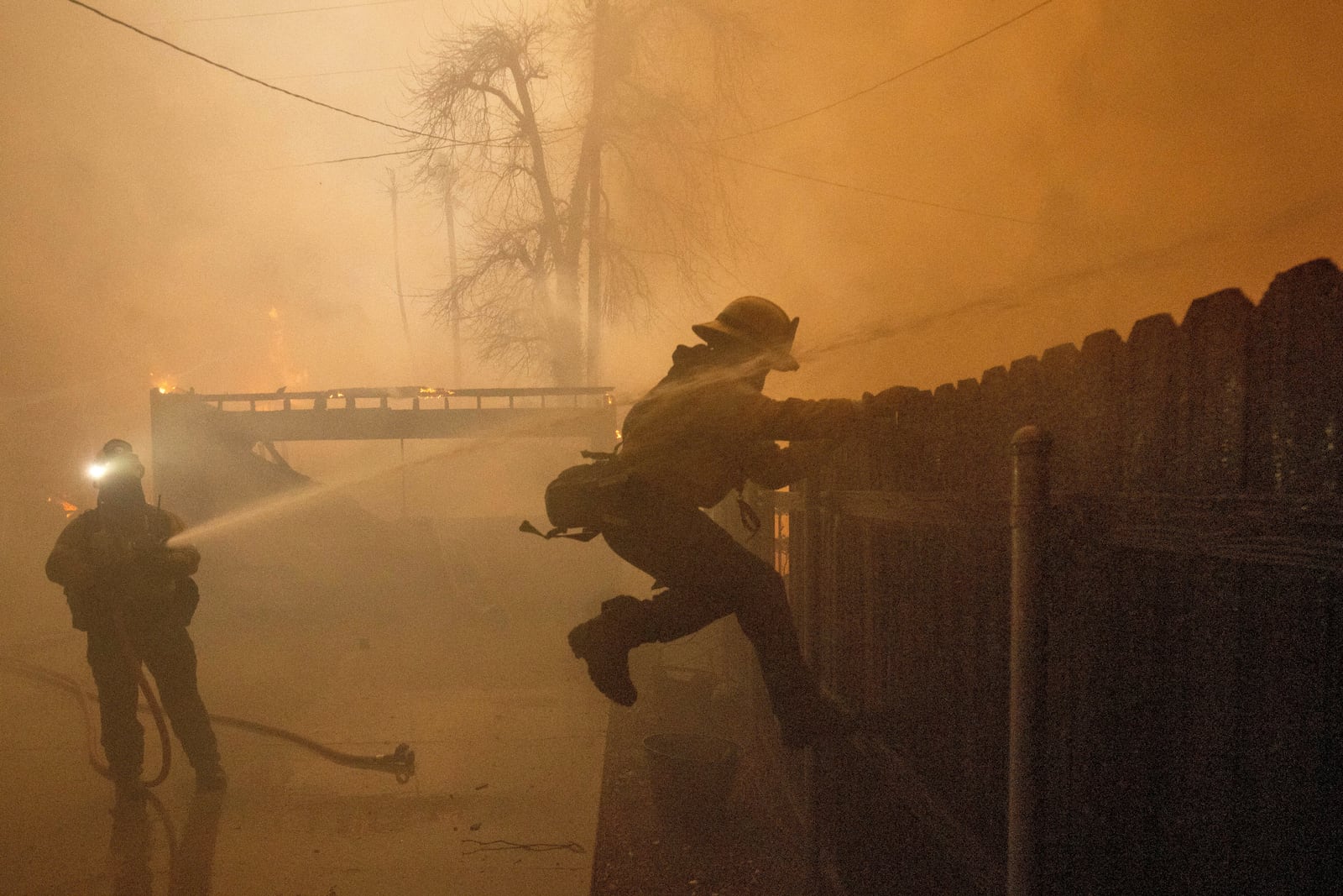 Fire crews battle the Eaton Fire Wednesday, Jan. 8, 2025 in Altadena, Calif. (AP Photo/Ethan Swope)