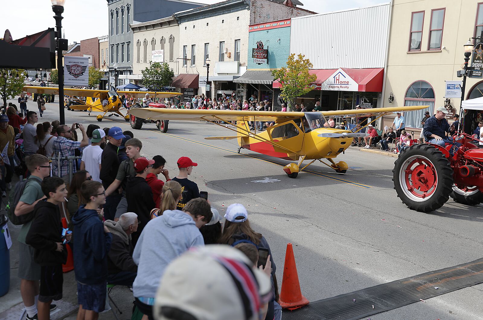 Hundreds of people lined Main Street in New Carlisle for the annual Airplane Parade which kicks off the Heritage of Flight Festival Saturday. BILL LACKEY/STAFF