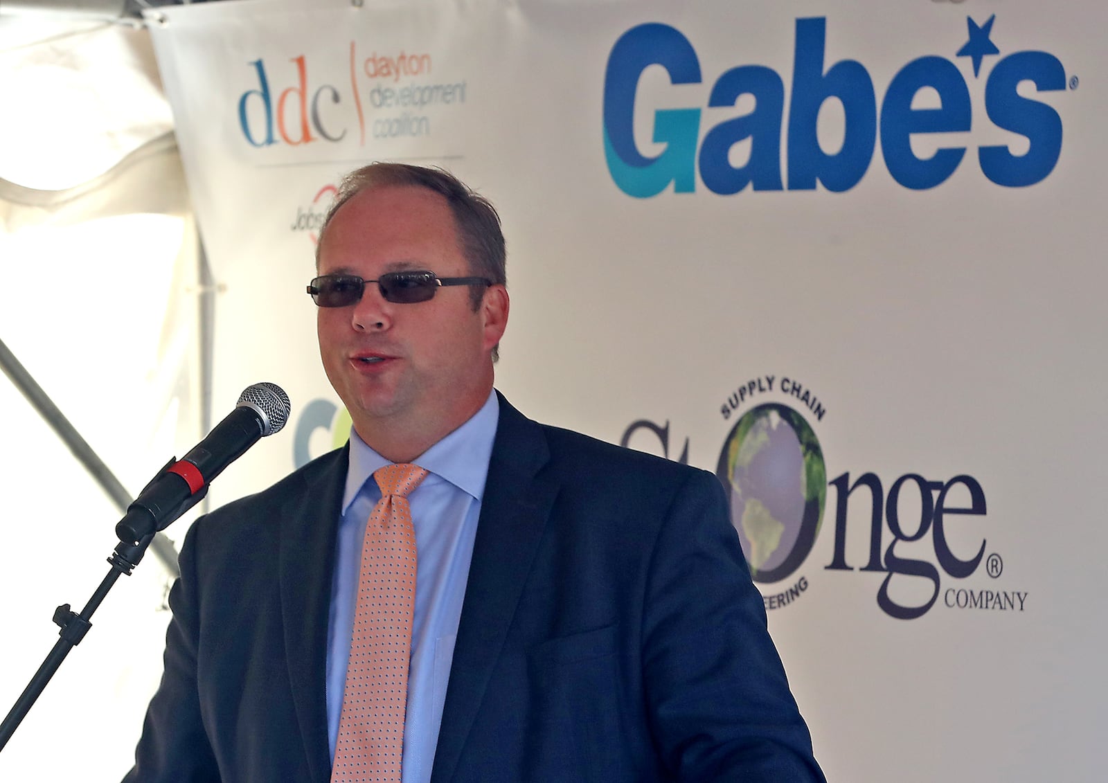 Horton Hobbs, from the Greater Springfield Partnership, speaks during a groundbreaking ceremony for the new Gabe's distribution center. BILL LACKEY/STAFF