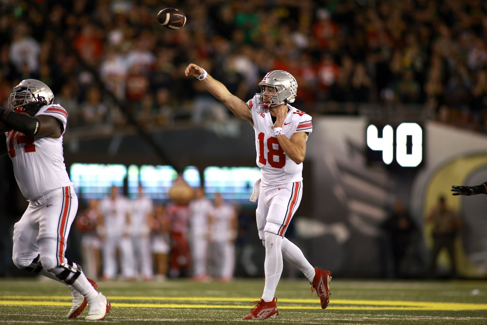 Ohio State quarterback Will Howard (18) passes the ball during an NCAA college football game against Oregon, Saturday, Oct. 12, 2024, in Eugene, Ore. (AP Photo/Lydia Ely)