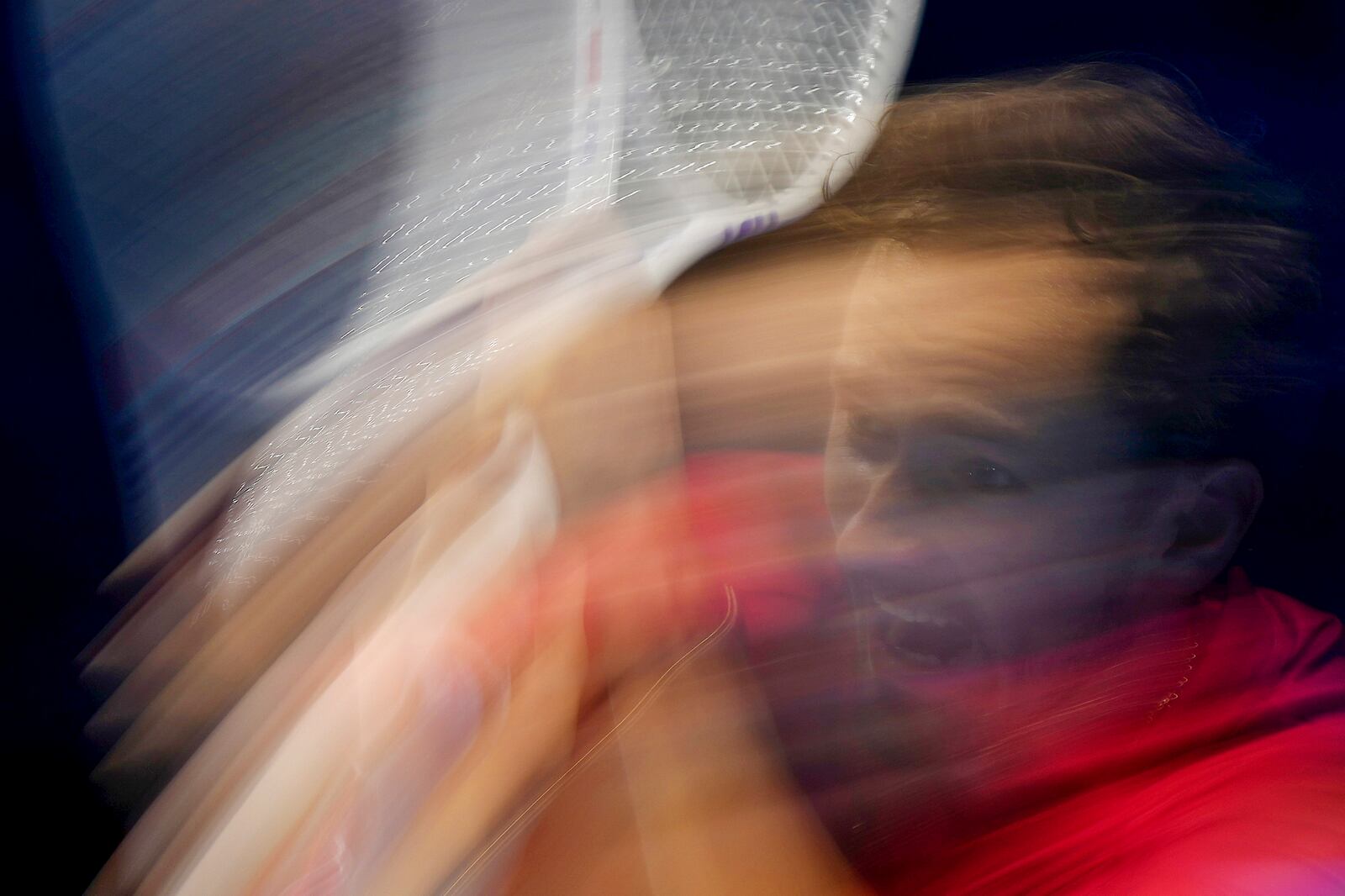 Russia's Daniil Medvedev returns the ball to Australia's Alex de Minaur during their singles tennis match of the ATP World Tour Finals at the Inalpi Arena, in Turin, Italy, Tuesday, Nov. 12, 2024. (AP Photo/Antonio Calanni)