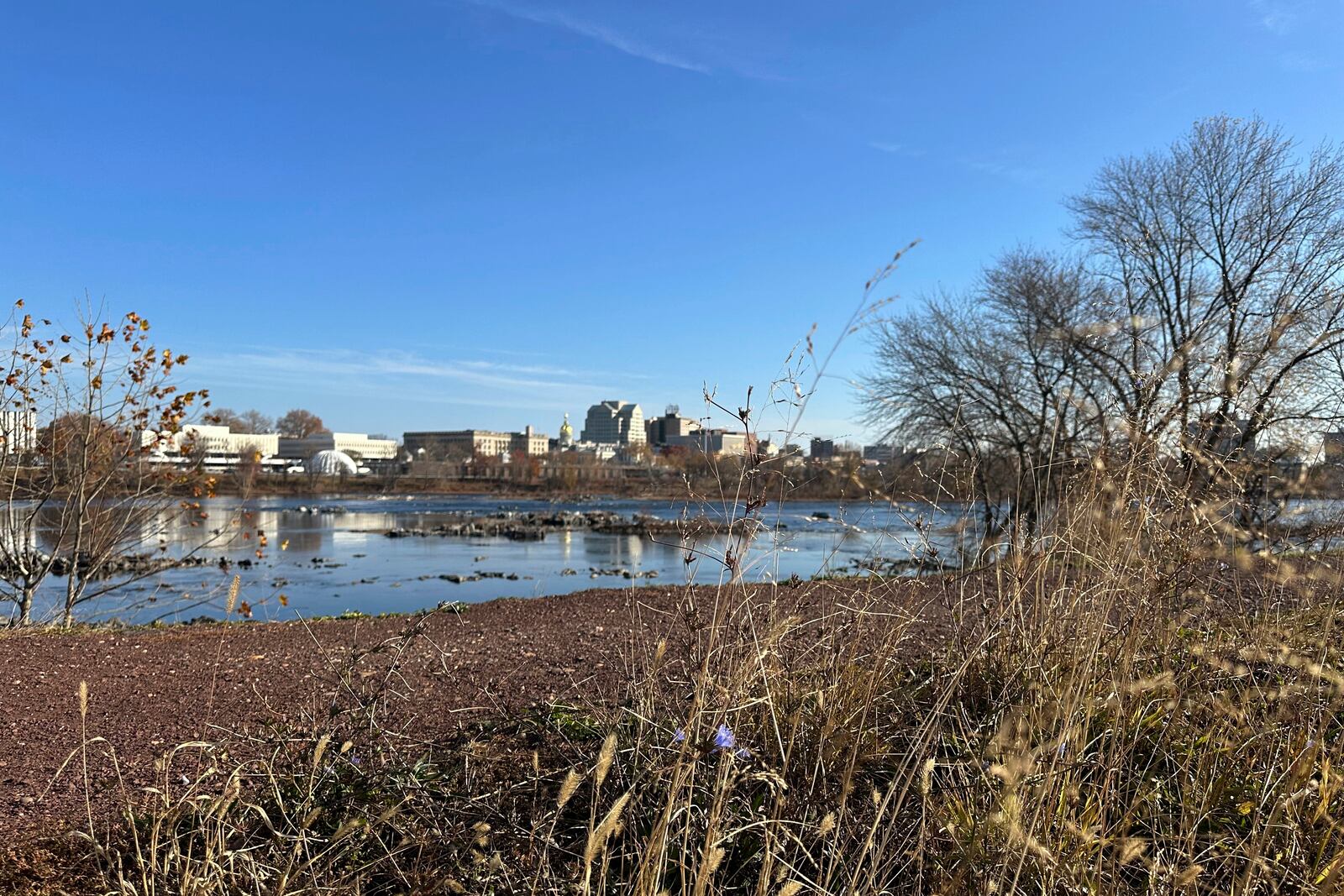 The Delaware River overlooking Trenton, N.J. flows downstream as seen from from Morrisville, Pa., on Monday, Nov. 25, 2024. (AP Photo/Mike Catalini)