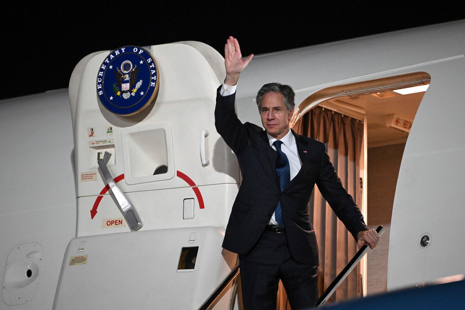 US Secretary of State Antony Blinken waves farewell as he boards his plane in Aqaba, Jordan, on Saturday, Dec. 14, 2024. (Andrew Caballero-Reynolds/Pool Photo via AP)