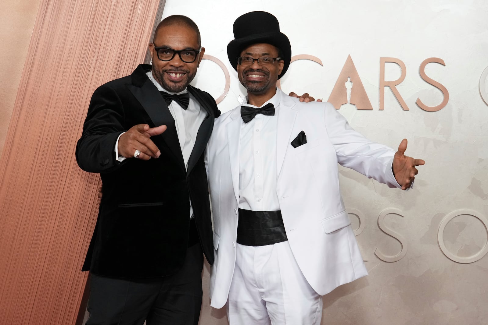 Clarence Maclin, left, and Divine G arrive at the Oscars on Sunday, March 2, 2025, at the Dolby Theatre in Los Angeles. (Photo by Jordan Strauss/Invision/AP)