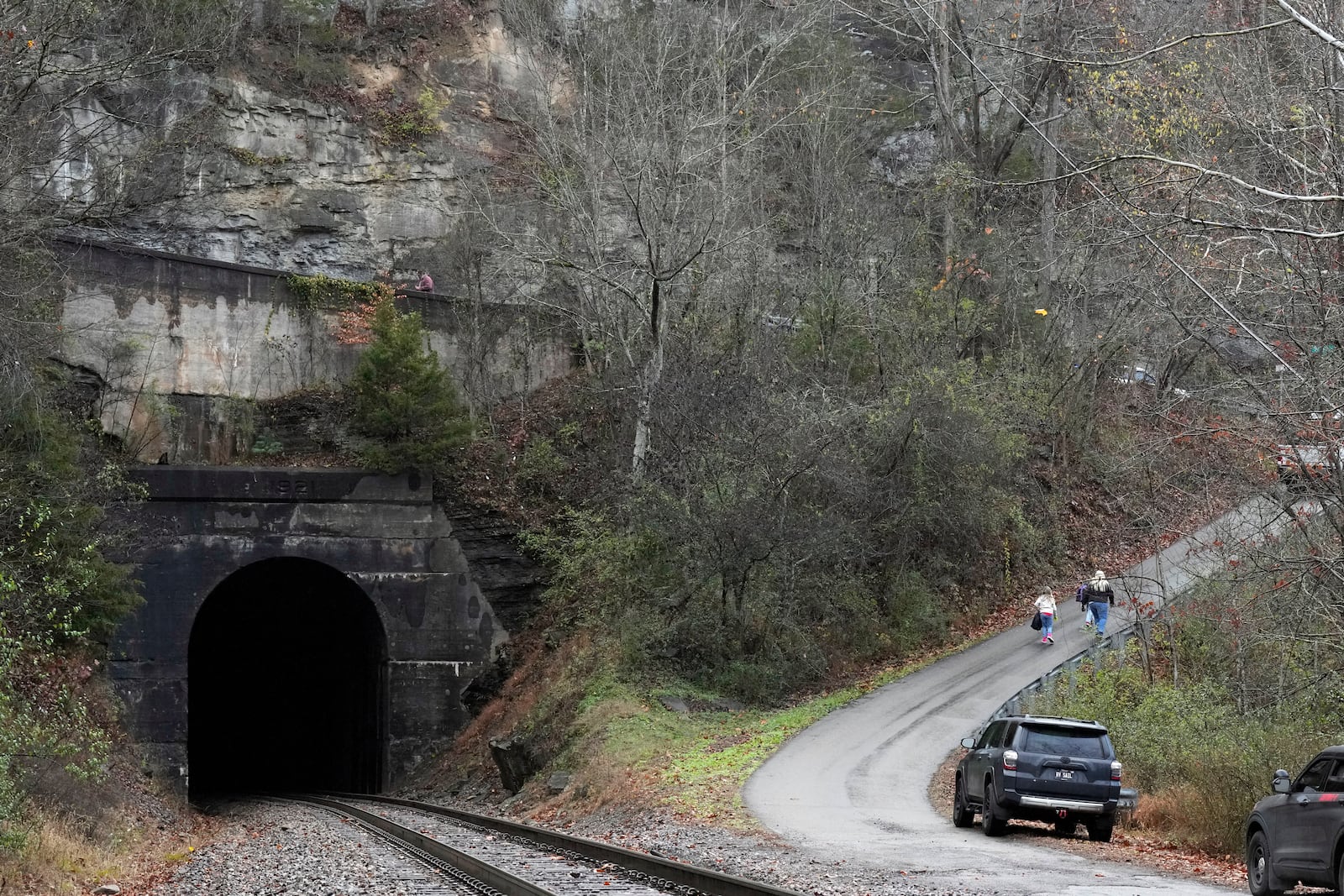 People leave after a visit of the CSX Santa Train, Saturday, Nov. 23, 2024, in Haysi, Va. The train brings presents to small towns along a 110-mile portion of the railroad line in rural Appalachian Tennessee, Kentucky and Virginia. (AP Photo/George Walker IV)