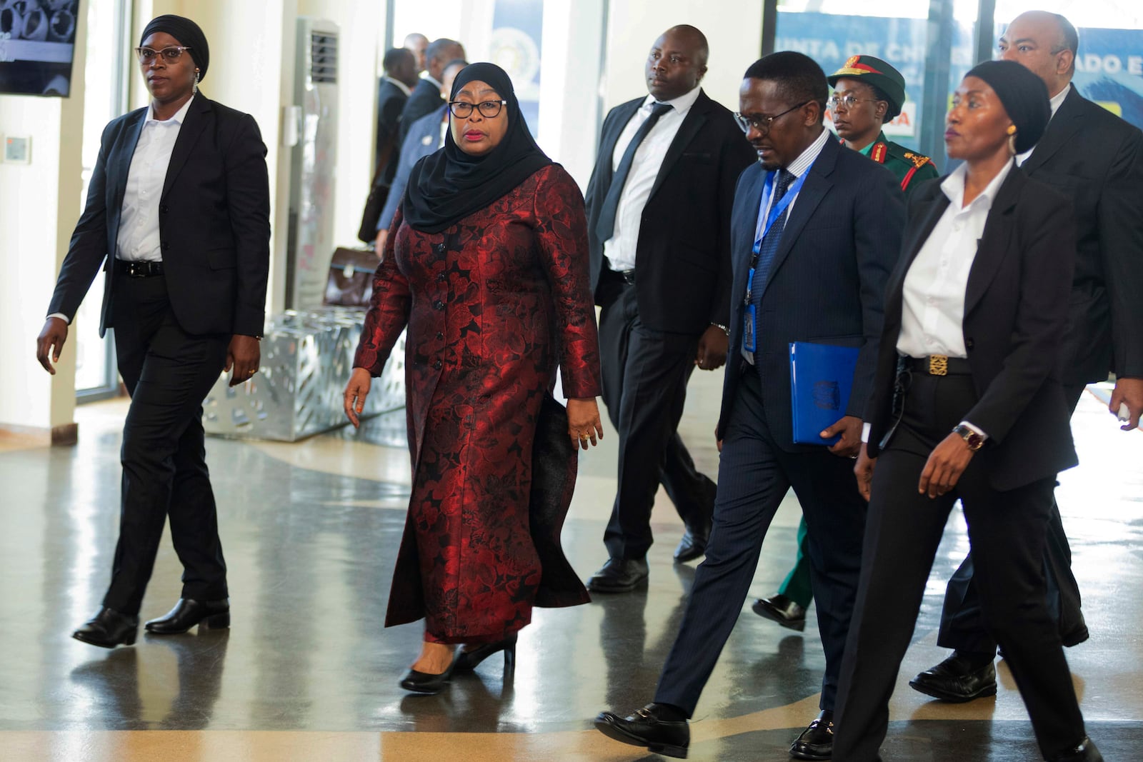 Tanzania President Samia Suluhu, center left, arrives to attends a joint summit to address conflict in Eastern Democratic Republic of Congo, hosted by the Southern African Development Community (SADC) and the East Africa Community (EAC) in Dar es Salaam, Tanzania Saturday, Feb. 8, 2025. (AP Photo/Elia Yunga)