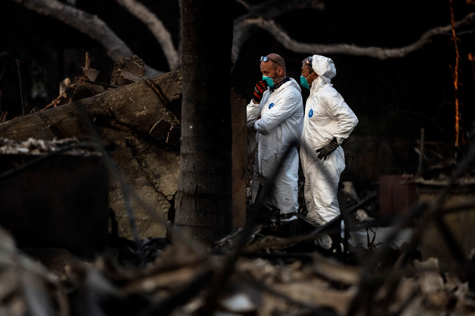 A search team works at a home destroyed by the Eaton Fire in Altadena, Calif., Saturday, Jan. 11, 2025. (Stephen Lam/San Francisco Chronicle via AP)