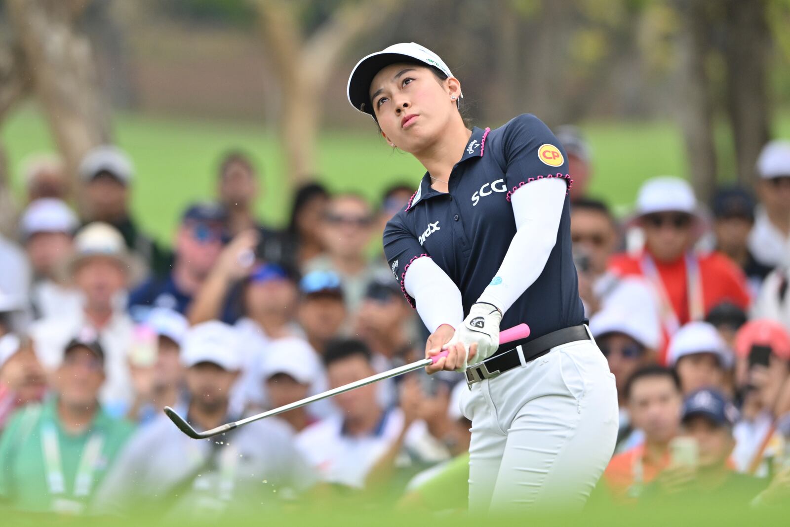 Atthaya Thitikul of Thailand chips the ball on green from the 1st hole during the first round of the LPGA Honda Thailand golf tournament in Pattaya, southern Thailand, Thursday, Feb. 20, 2025. (AP Photo/Kittinun Rodsupan)