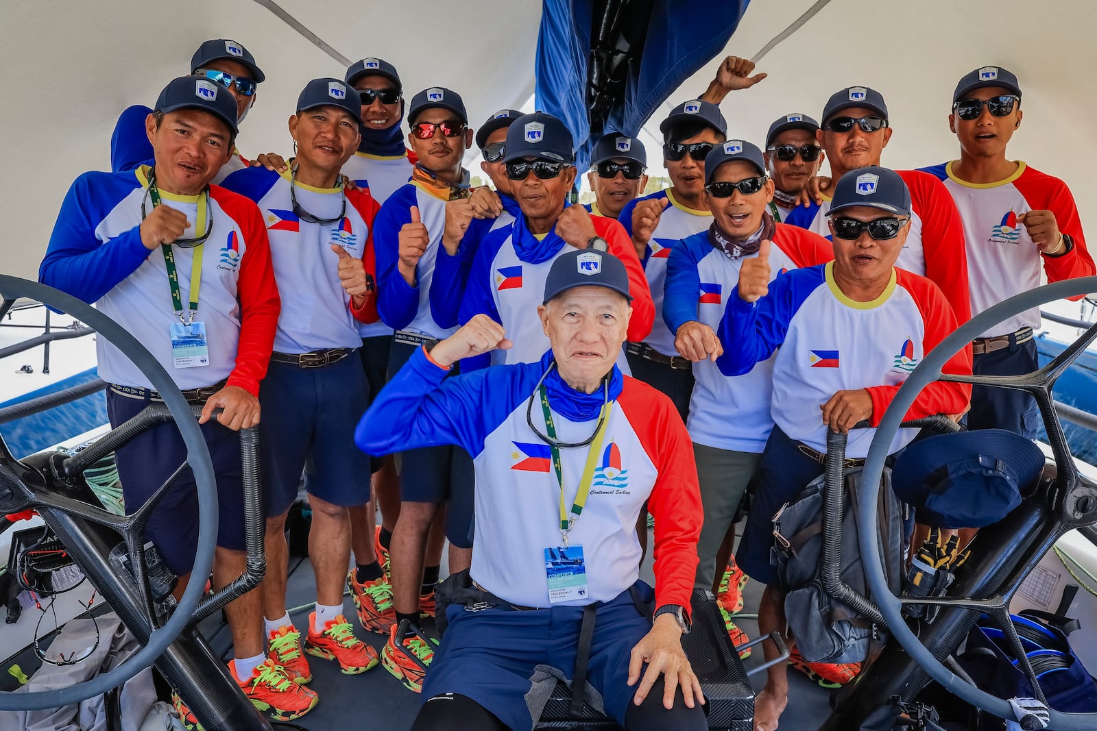 Skipper of Philippines entry Centennial, Ernesto Echauz, center, gestures with his crew ahead of the Sydney to Hobart yacht race in Sydney, Monday, Dec. 23, 2024. (Salty Dingo via AP)