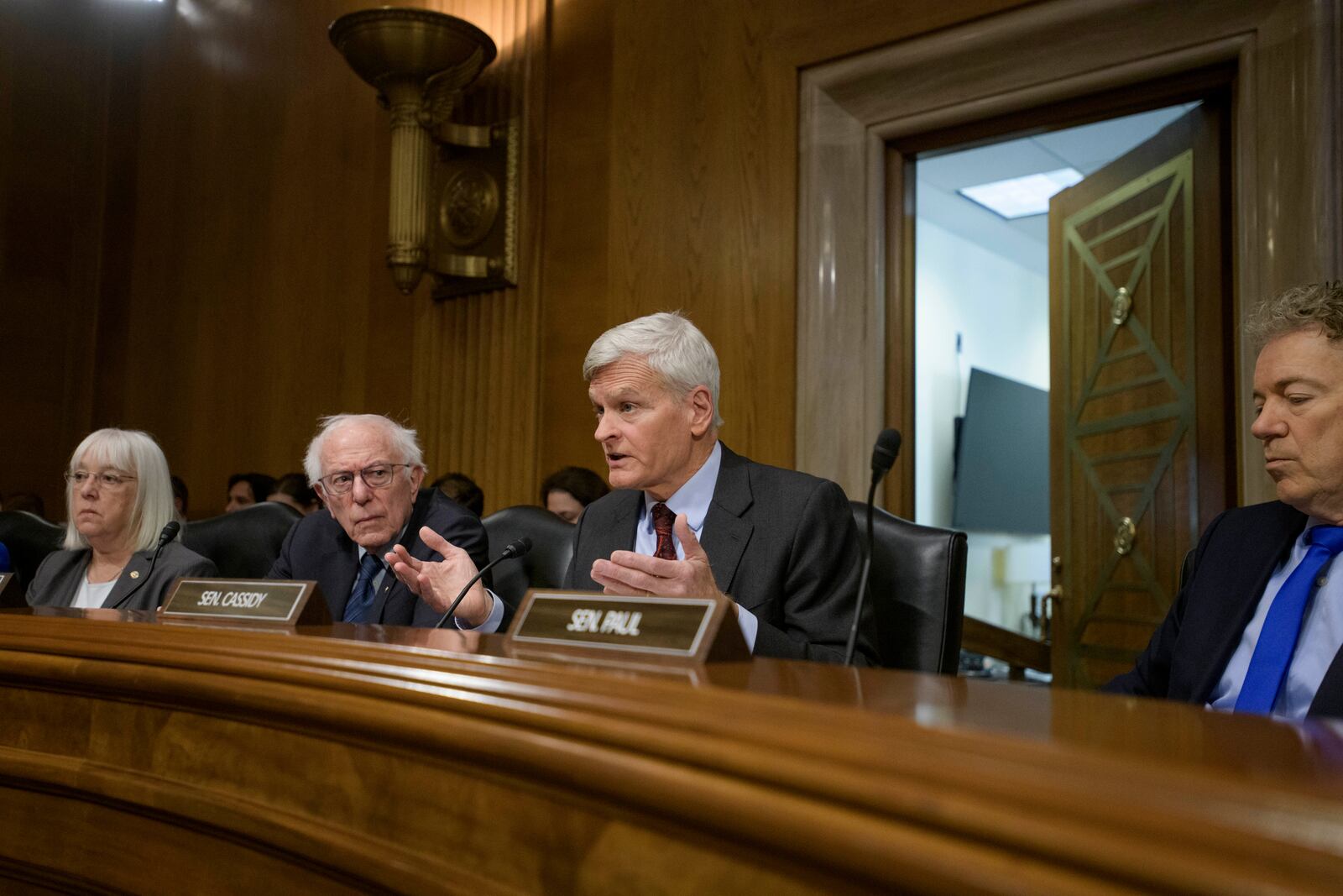 Committee Chairman Sen. Bill Cassidy, R-La., second from right, is joined by Sen. Patty Murray, D-Wash., from left, Committee Ranking Member Sen. Bernie Sanders, I-Vt., and Sen. Rand Paul, R-Ky., as he delivers his opening statement to Robert F. Kennedy, Jr., President Trump's nominee to serve as Secretary of Health and Human Services, during a Senate Committee on Health, Education, Labor and Pensions hearing for his pending confirmation on Capitol Hill, Thursday, Jan. 30, 2025, in Washington. (AP Photo/Rod Lamkey, Jr.)