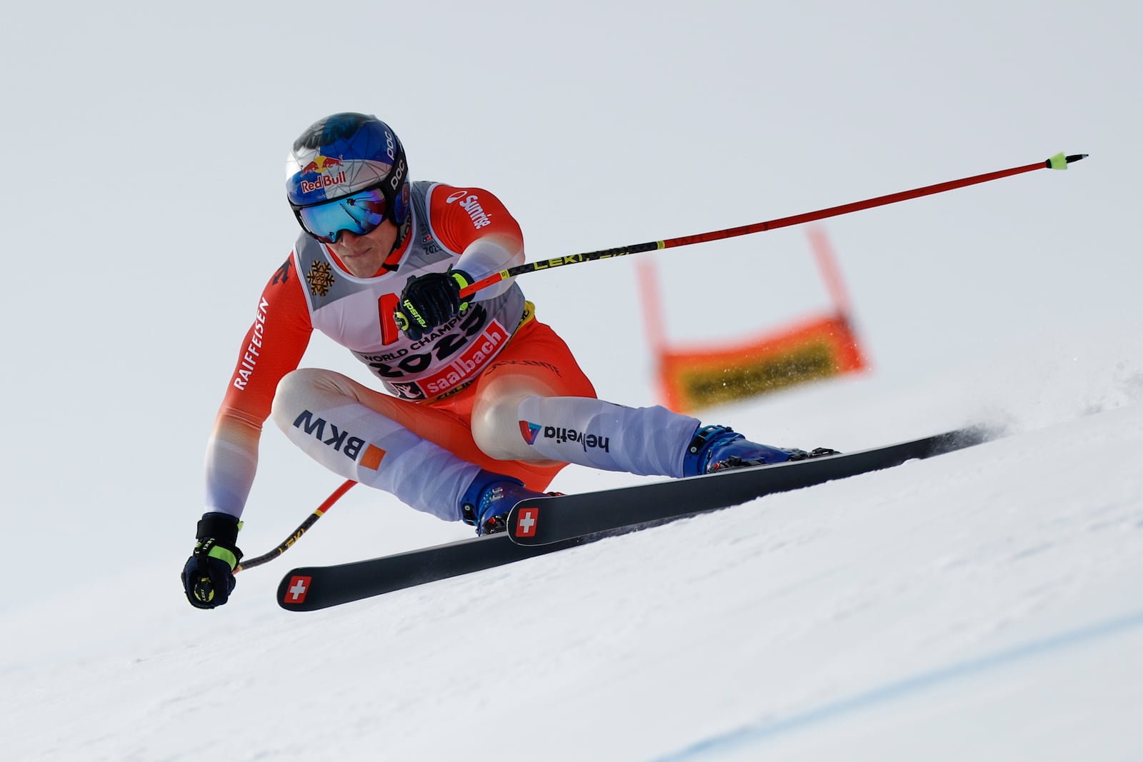 Switzerland's Marco Odermatt speeds down the course during a men's downhill race, at the Alpine Ski World Championships, in Saalbach-Hinterglemm, Austria, Sunday, Feb. 9, 2025. (AP Photo/Gabriele Facciotti)