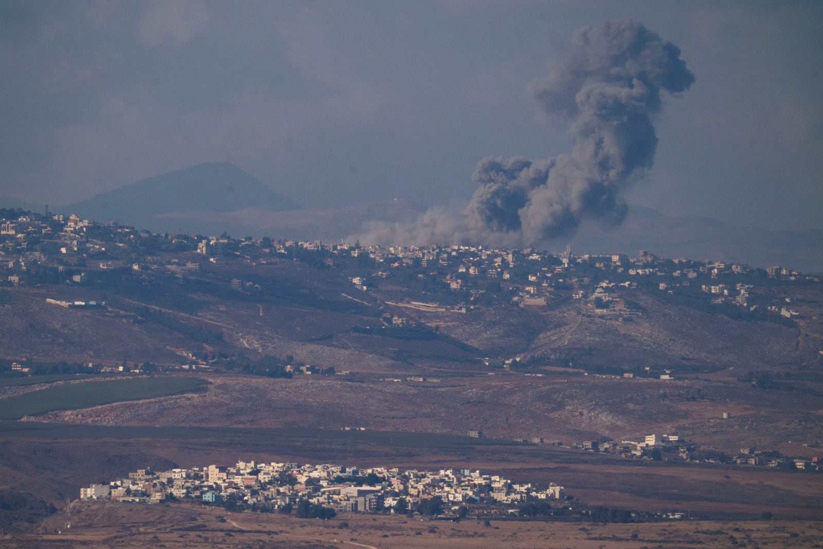 Smoke rises following Israeli bombardment in southern Lebanon as seen from northern Israel, Thursday, Oct. 17, 2024. (AP Photo/Leo Correa)