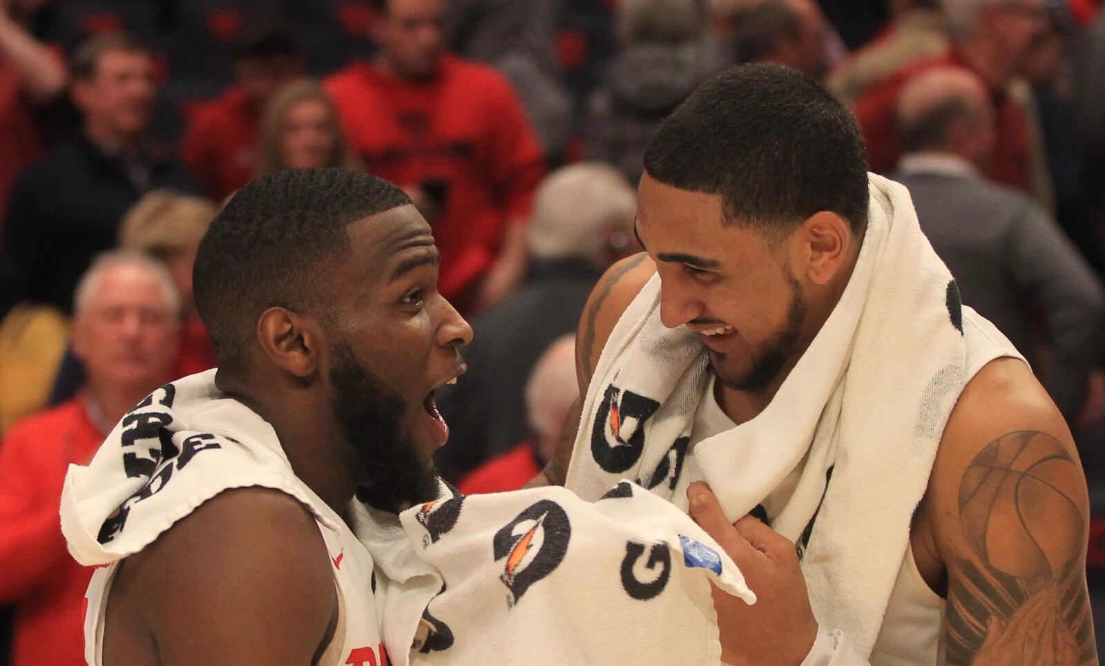 Dayton’s Jalen Crutcher and Obi Toppin smile after a victory against Virginia Commonwealth on Tuesday, Jan. 14, 2020, at UD Arena.