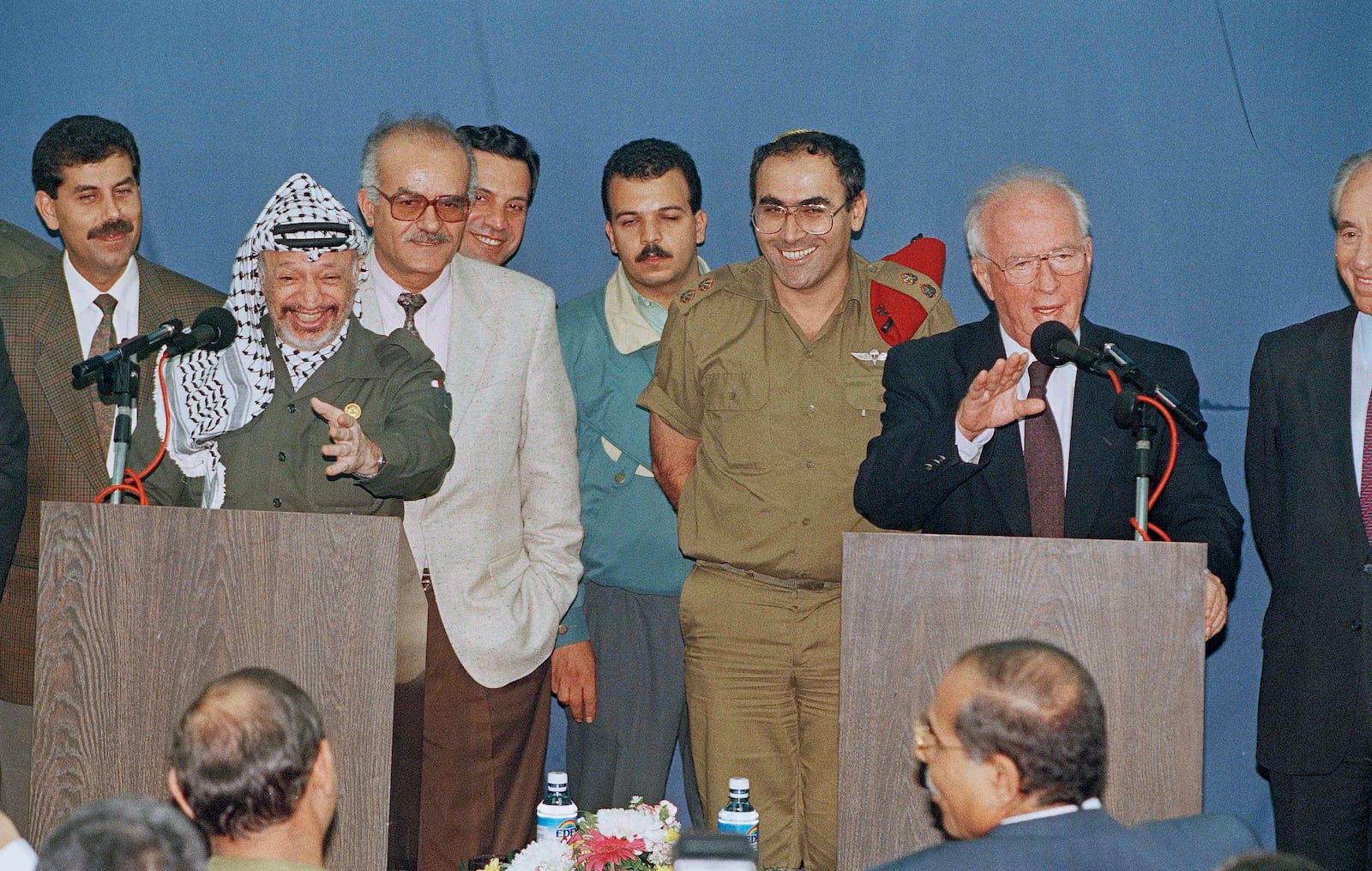 FILE - PLO leader Yasser Arafat, left, and Israeli Prime Minister Yitzhak Rabin, right, both gesture at a joint press conference after their meeting held at the Erez Crossing, at the northern end of the Gaza Strip border with Israel, Nov. 8, 1994. (AP Photo/Nati Harnik, FIle)