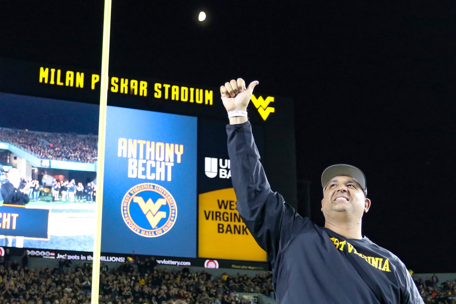 Former WVU player Anthon Becht is recognized during the first half of an NCAA college football game, Saturday, Oct. 12, 2024, in Morgantown, W.Va. (AP Photo/William Wotring)