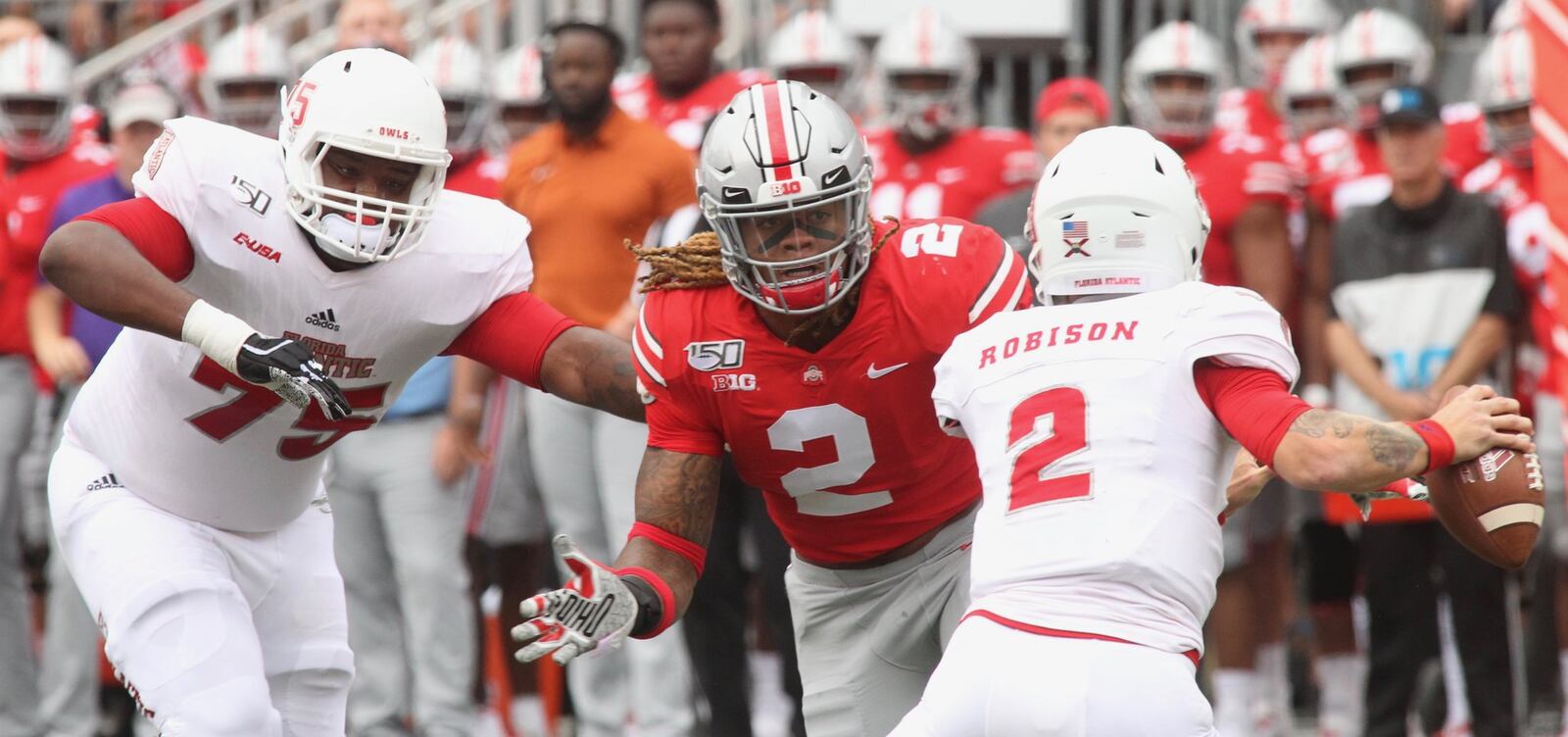 Ohio State’s Chase Young pursues Florida Atlantic quarterback Chris Robinson and records the first sack of the season on Saturday, Aug. 31, 2019, at Ohio Stadium in Columbus. David Jablonski/Staff