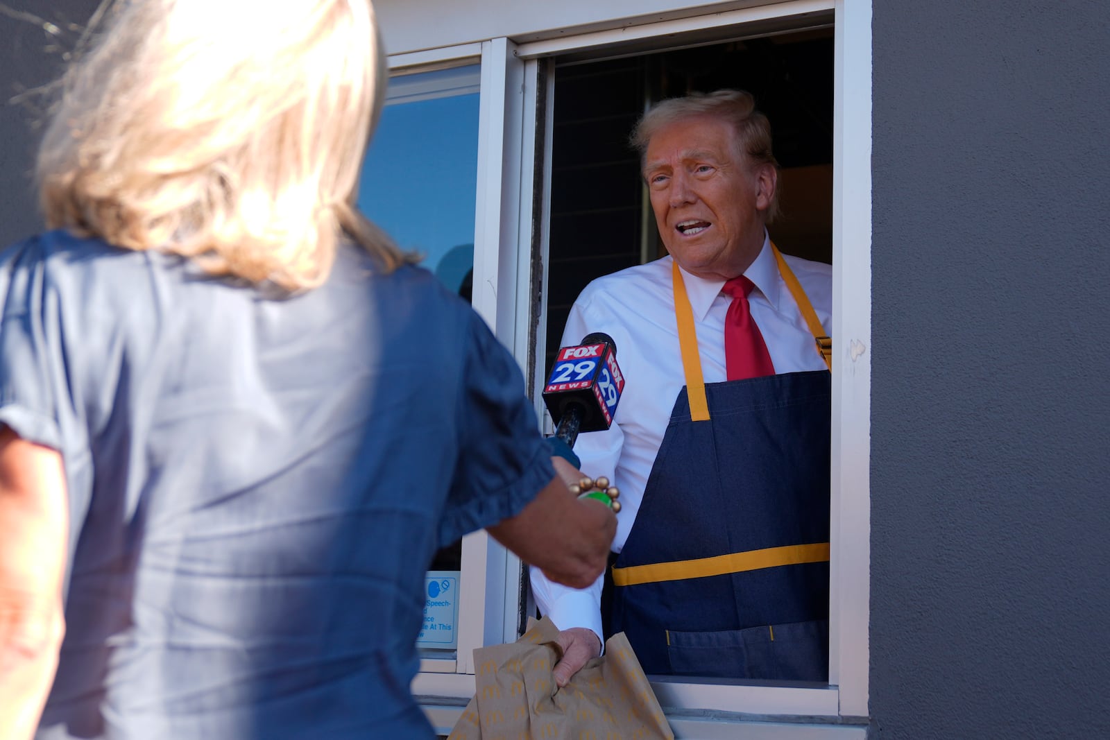 Republican presidential nominee former President Donald Trump speaks during an interview at a drive-thru window during a campaign stop at a McDonald's, Sunday, Oct. 20, 2024, in Feasterville-Trevose, Pa. (AP Photo/Evan Vucci)