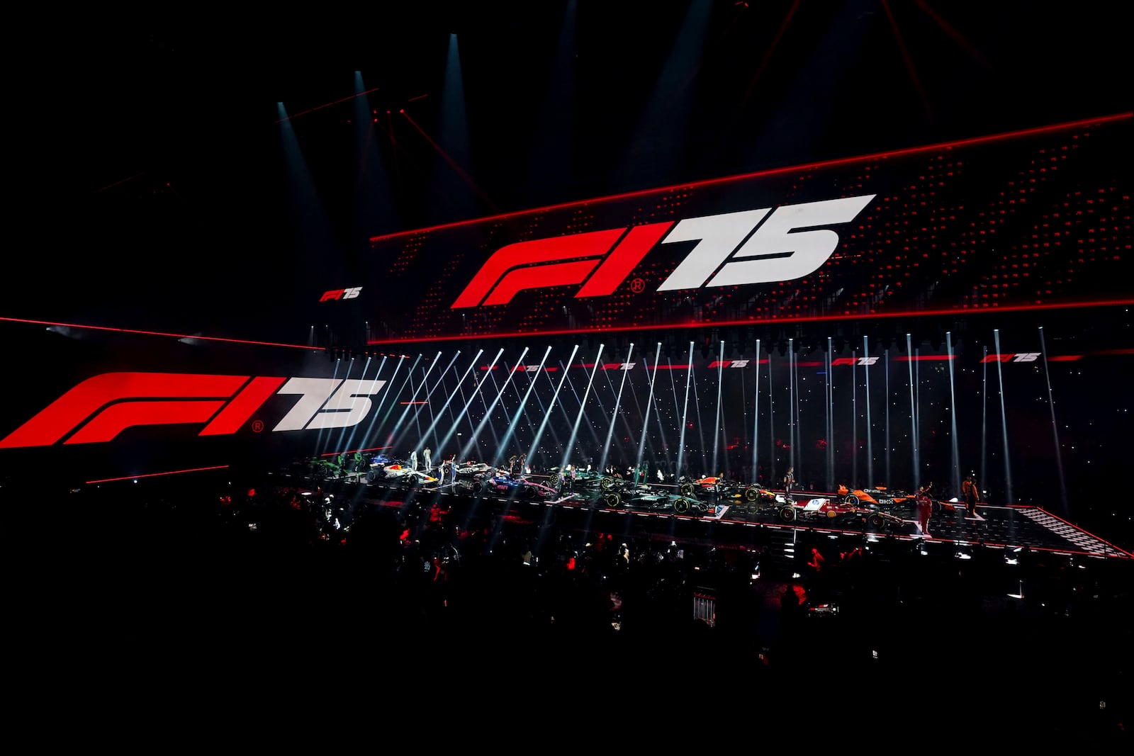 Drivers stand with their new cars during the F1 75 Live event at the O2 arena in London, Tuesday, Feb. 18, 2025.(Bradley Collyer/PA via AP)