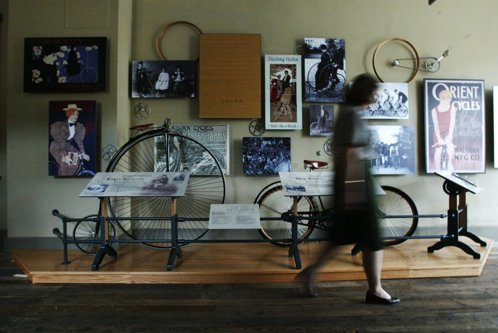 National Park Service historian Ann Honious walks past a new exhibit at the Wright Cycle Shop.  CHIRS STEWART / STAFF