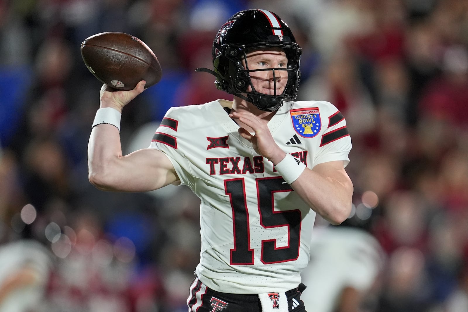 Texas Tech quarterback Will Hammond (15) looks to throw a pass during the first half of the Liberty Bowl NCAA college football game against Arkansas, Friday, Dec. 27, 2024, in Memphis, Tenn. (AP Photo/George Walker IV)