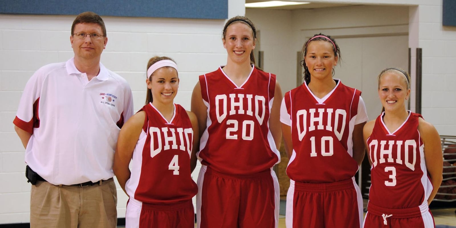 In a 2010 photo, Jim Dabbelt, left, is pictured with Allie Turner (Greenon), Cassie Sant (Fairmont), Courtney Boyd (Brookville) and Kacie Cassell (Vandalia Butler) after Ohio routed Kentucky 84-55 in the 19th annual Ohio-Kentucky All-Star game at Thomas More College.