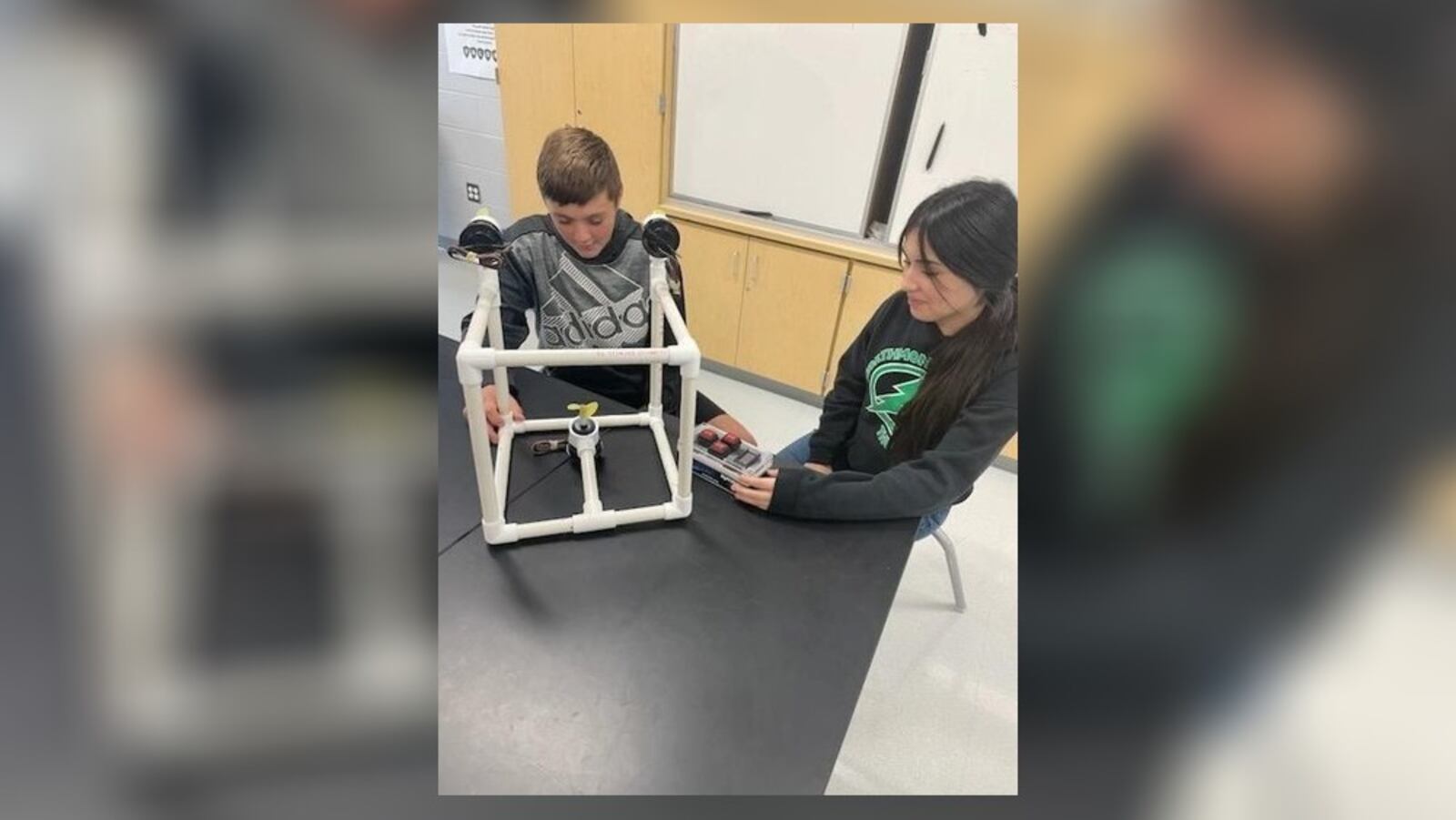 Greenon Junior High School will receive $5,000 to expand STEM learning projects through the Ohio STEM Learning Network Classroom Grant Program, through Battelle. The grant will be used to design a remotely operated vehicle. In this photo is Eli Paulus and Ana Cervantes checking out the prototype and remote of a sample of the project. Contributed