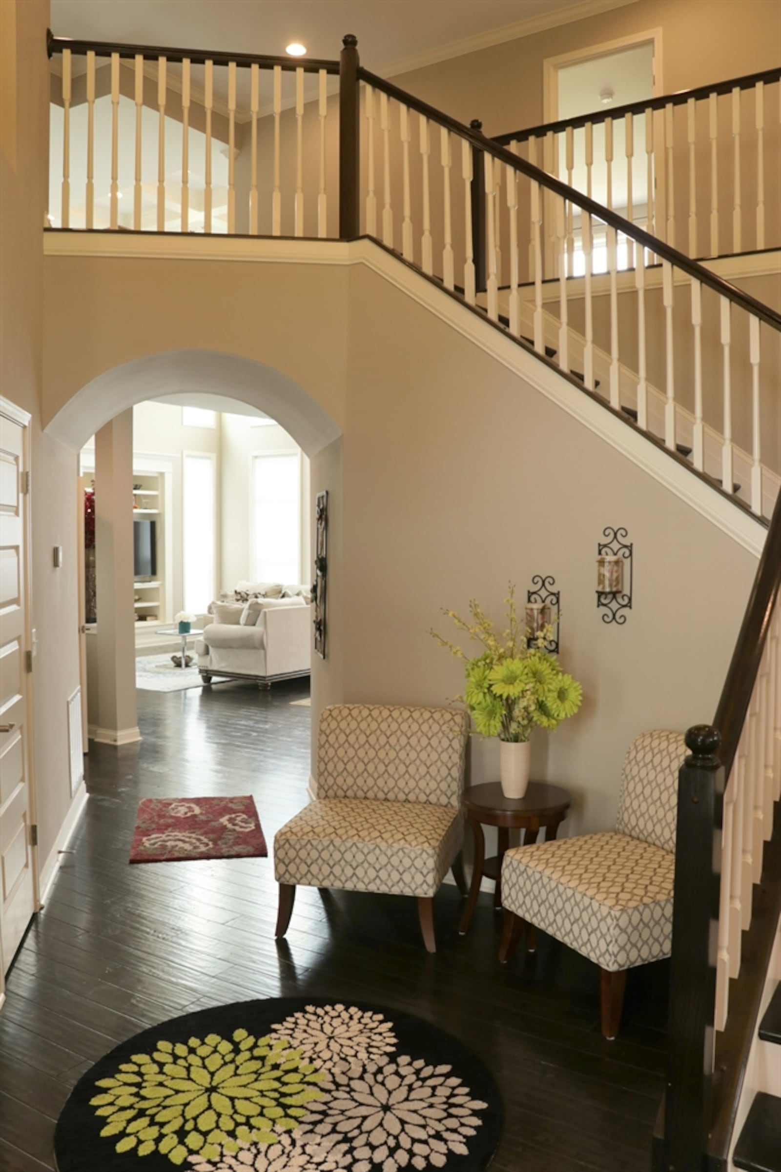 Formal entry opens into a two-story foyer with an open spindled-accented staircase with wood steps. Hardwood flooring fills the entire main level. The formal dining room is to the right off the foyer and a study is to the left through double doors. Kathy Tyler/CONTRIBUTED