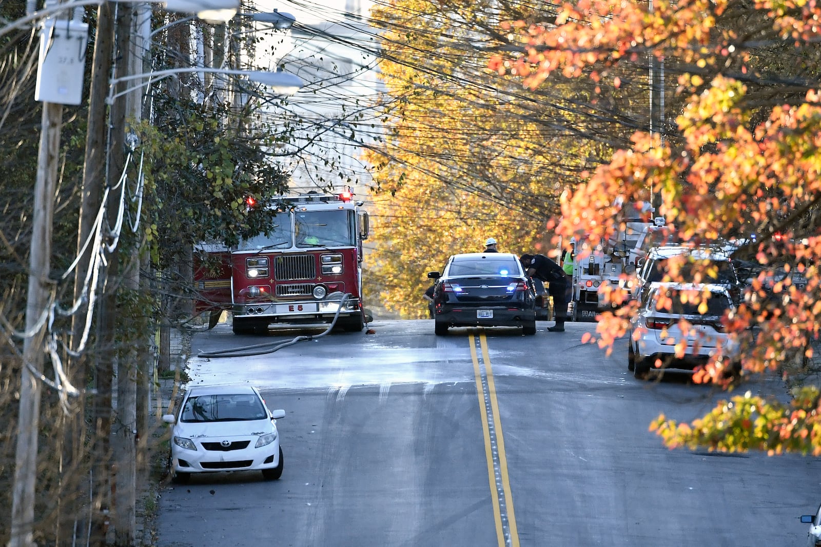 Members of the Louisville Metro Police and Louisville Fire Departments block access to Givaudan Sense Colour following an explosion at the facility in Louisville, Ky., Tuesday, Nov. 12, 2024. (AP Photo/Timothy D. Easley)