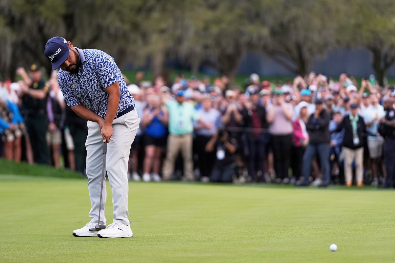 J.J. Spaun putts on the 18th green during the final round of The Players Championship golf tournament Sunday, March 16, 2025, in Ponte Vedra Beach, Fla. (AP Photo/Julia Demaree Nikhinson)