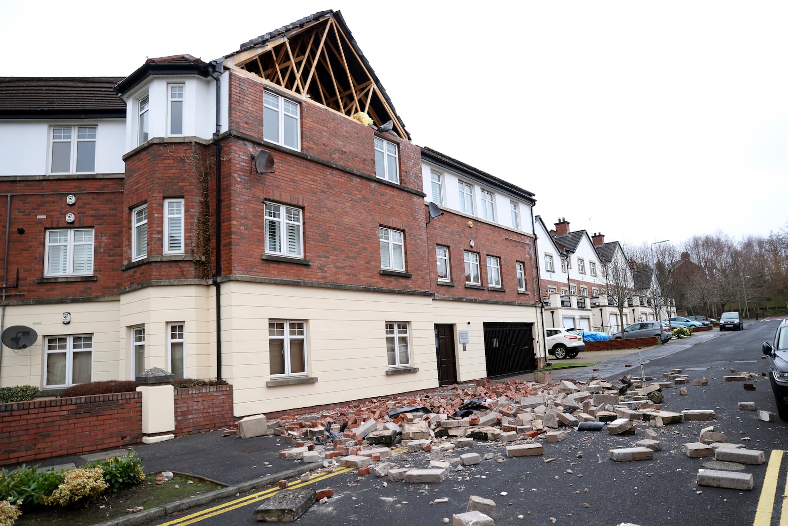 Parts of a wall of a house have fallen down caused by the winds of storm Eowyn that hit the country in Belfast, Northern Ireland, Friday, Jan. 24, 2025.(AP Photo)