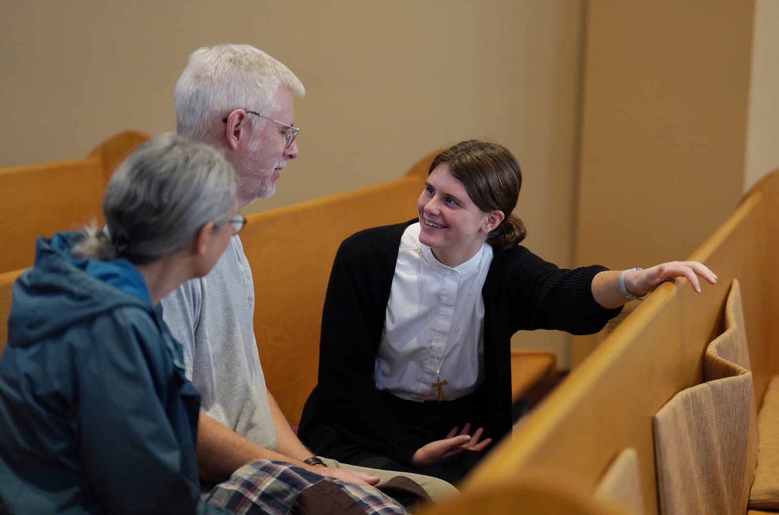 Zoey Stapleton, right, a postulant with the Franciscan Sisters T.O.R., of Penance of the Sorrowful Mother, talks with her parents who are visiting from Pennsylvania after Mass in the chapel of the mother house in Toronto, Ohio, Thursday, Nov. 7, 2024. (AP Photo/Jessie Wardarski)