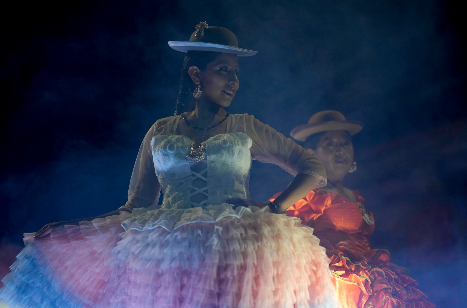 Women model creations by a local designer at a Chola fashion show, promoting the Andean style and beauty of Aymara women, in Viacha, Bolivia, Friday, Nov. 29, 2024. (AP Photo/Juan Karita)