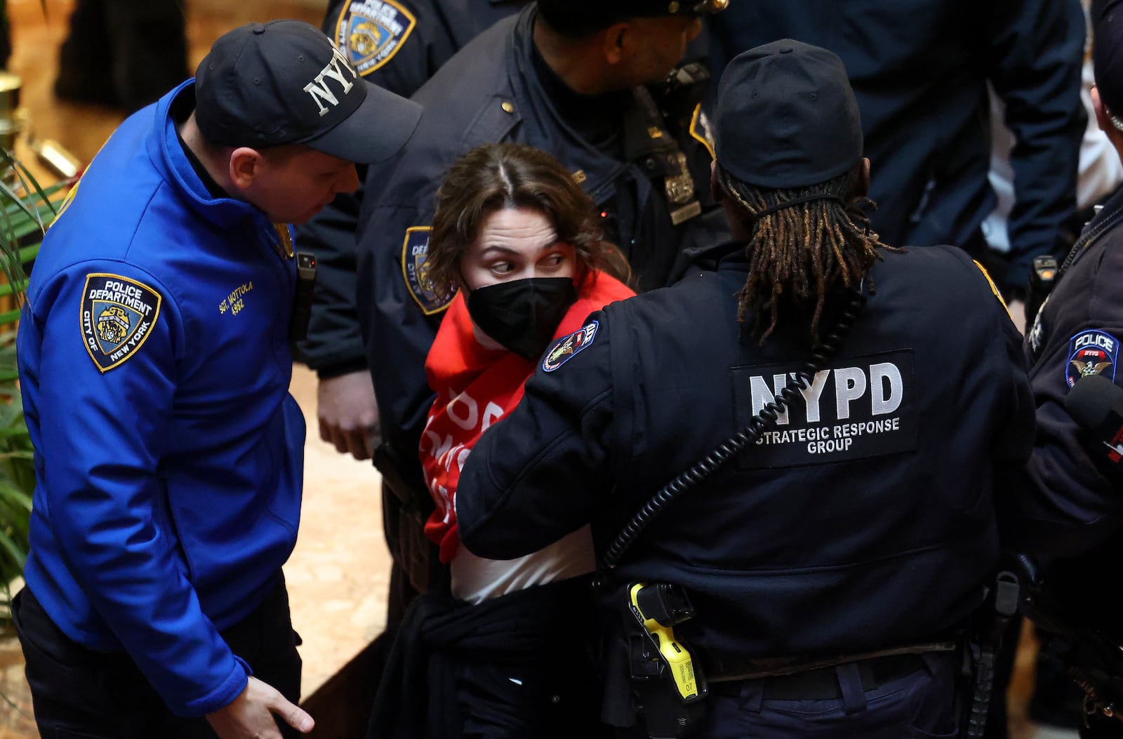 New York Police officers arrest a demonstrator from the group, Jewish Voice for Peace, who protested inside Trump Tower in support of Columbia graduate student Mahmoud Khalil, Thursday, March 13, 2025, in New York. (AP Photo/Yuki Iwamura)